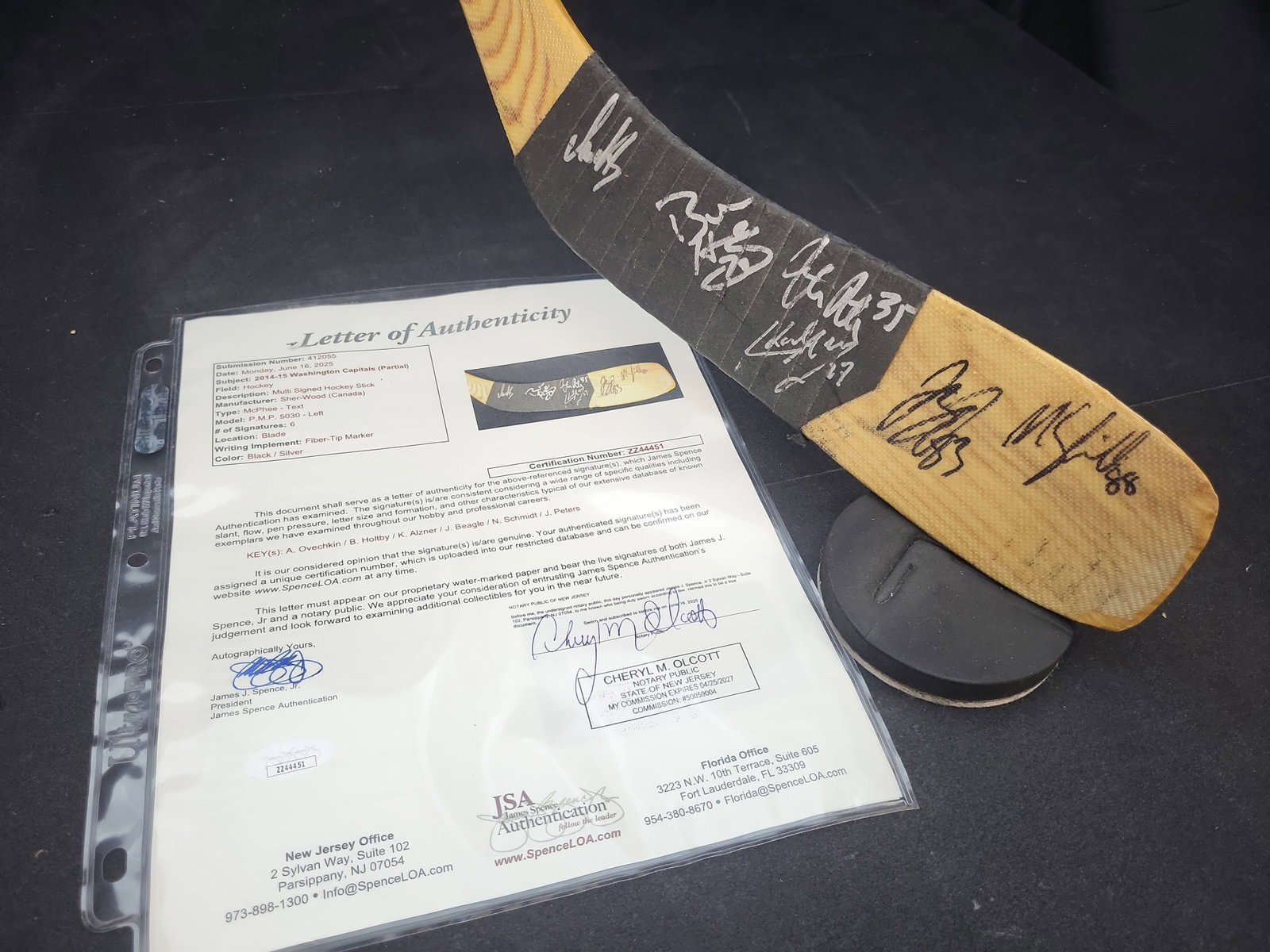 I03170 | 2014-15 Washington Capitals Multi-Signed Sher-Wood Hockey Stick with JSA LOA: BID PER WHAT YOU SEE IN THE PHOTO, NOT THE AI GENERATED TITLES AND DESCRIPTIONS! This is an autographed Sher-Wood P.M.P. 5030 left-hand hockey stick featuring signatures from members of the 2014-15 Wa