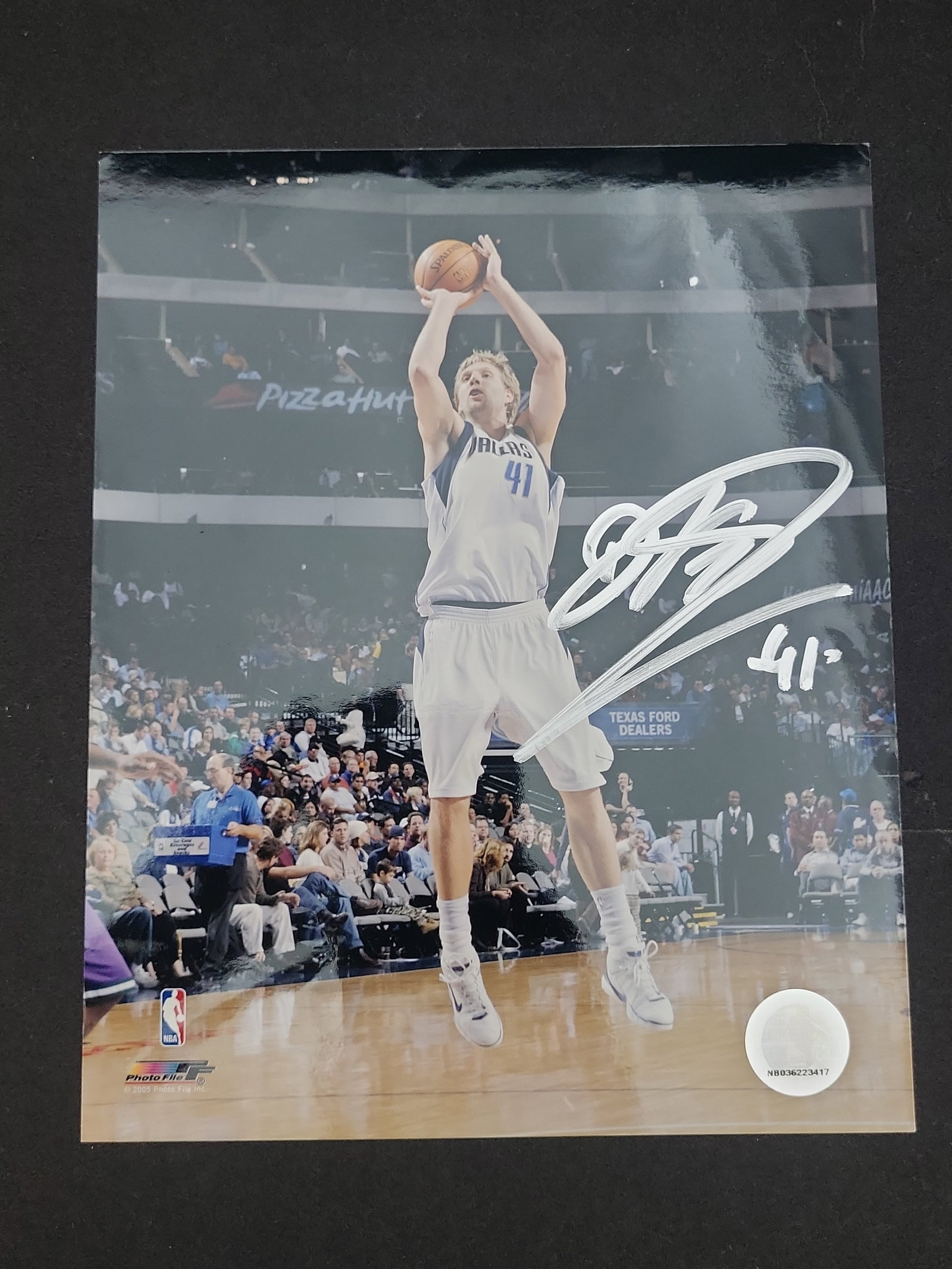 I03007 | Dirk Nowitzki Signed Dallas Mavericks 8x10 Photograph with NBA Authentication: BID PER WHAT YOU SEE IN THE PHOTO, NOT THE AI GENERATED TITLES AND DESCRIPTIONS! Dirk Nowitzki Signed Dallas Mavericks 8x10 Photograph with NBA Authentication This signed professional color photograph