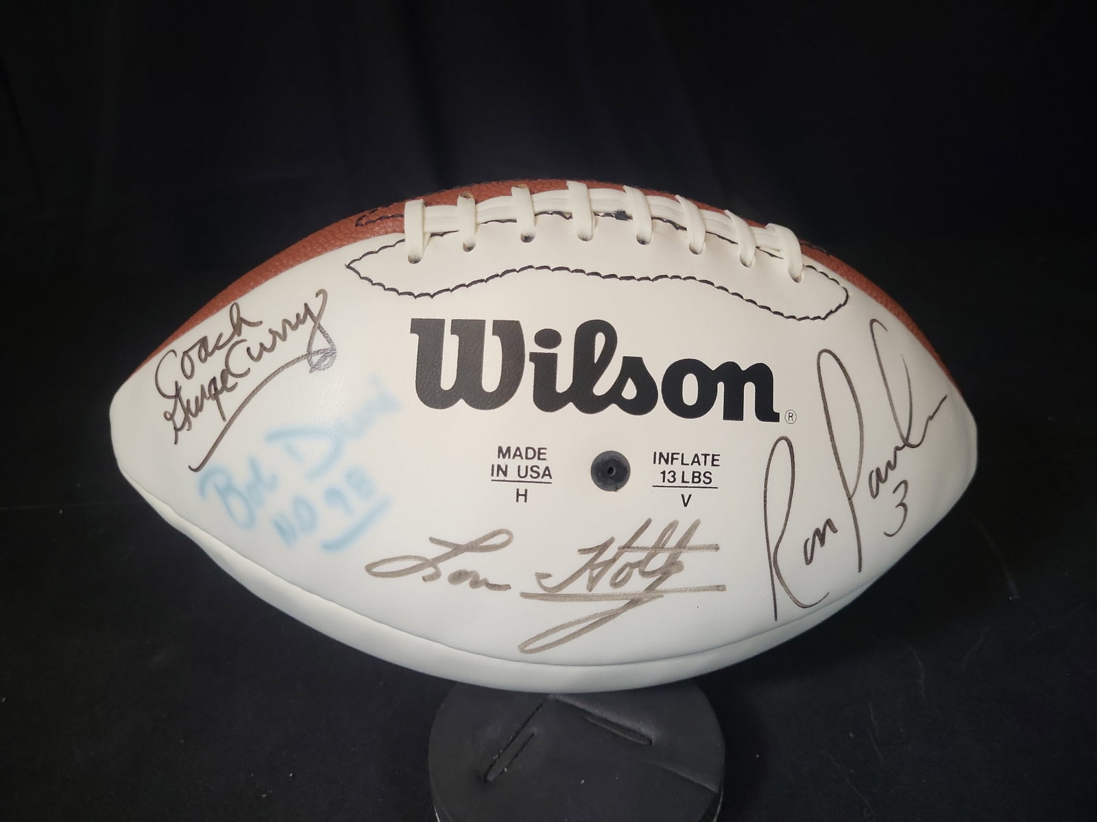 I03068 | Wilson NFL Multi Signed Football Featuring Lou Holtz Ron Powlus and Coach George Curry: BID PER WHAT YOU SEE IN THE PHOTO, NOT THE AI GENERATED TITLES AND DESCRIPTIONS! Wilson NFL Multi Signed Football Featuring Lou Holtz Ron Powlus and Coach George Curry A Wilson brand NFL football feat