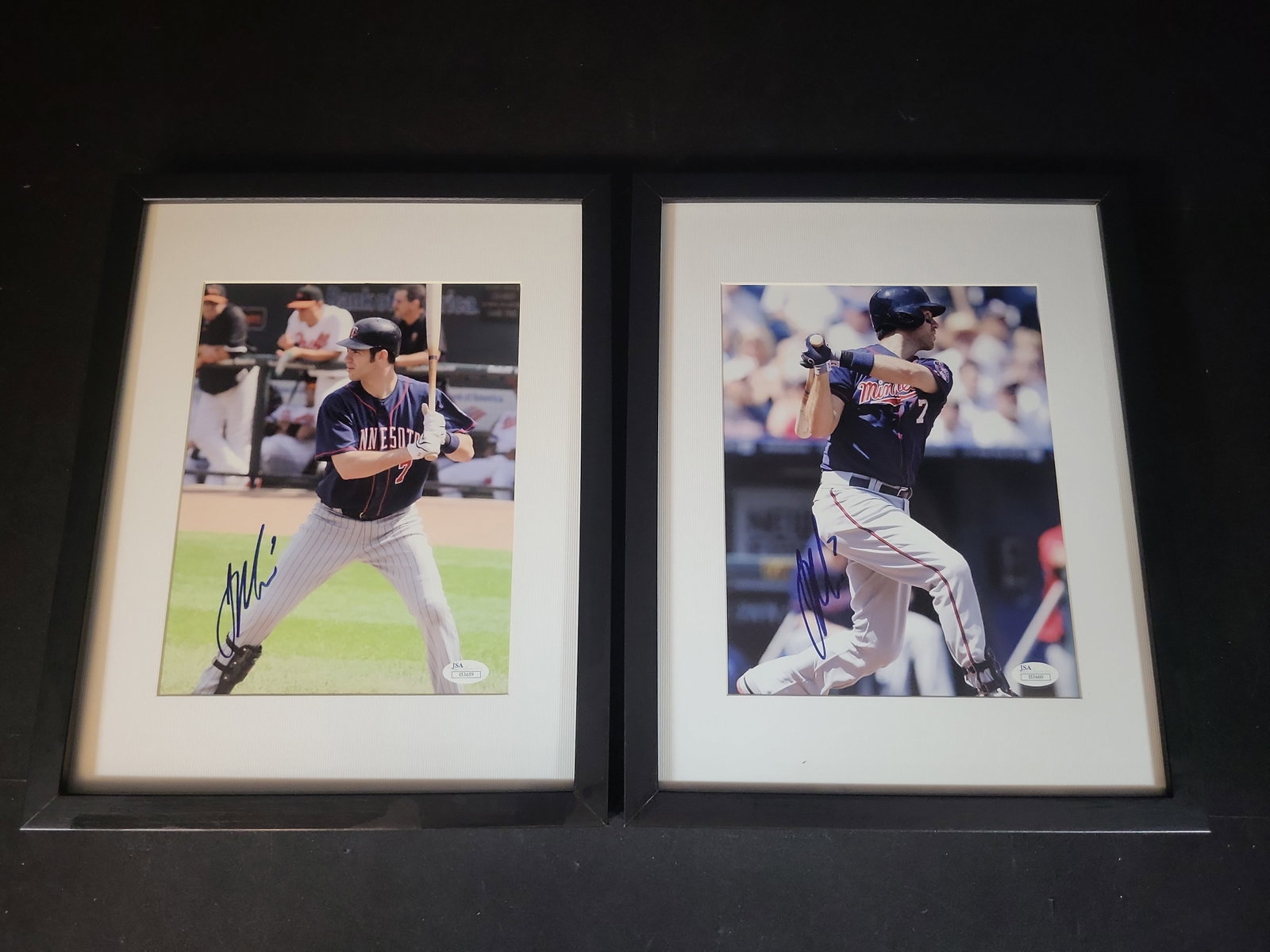 I03245 | A Pair of Joe Mauer Autographed and Framed Minnesota Twins Photographs with JSA COAs: BID PER WHAT YOU SEE IN THE PHOTO, NOT THE AI GENERATED TITLES AND DESCRIPTIONS! This lot features a pair of professionally framed and matted color photographs, each hand-signed by Major League Baseba