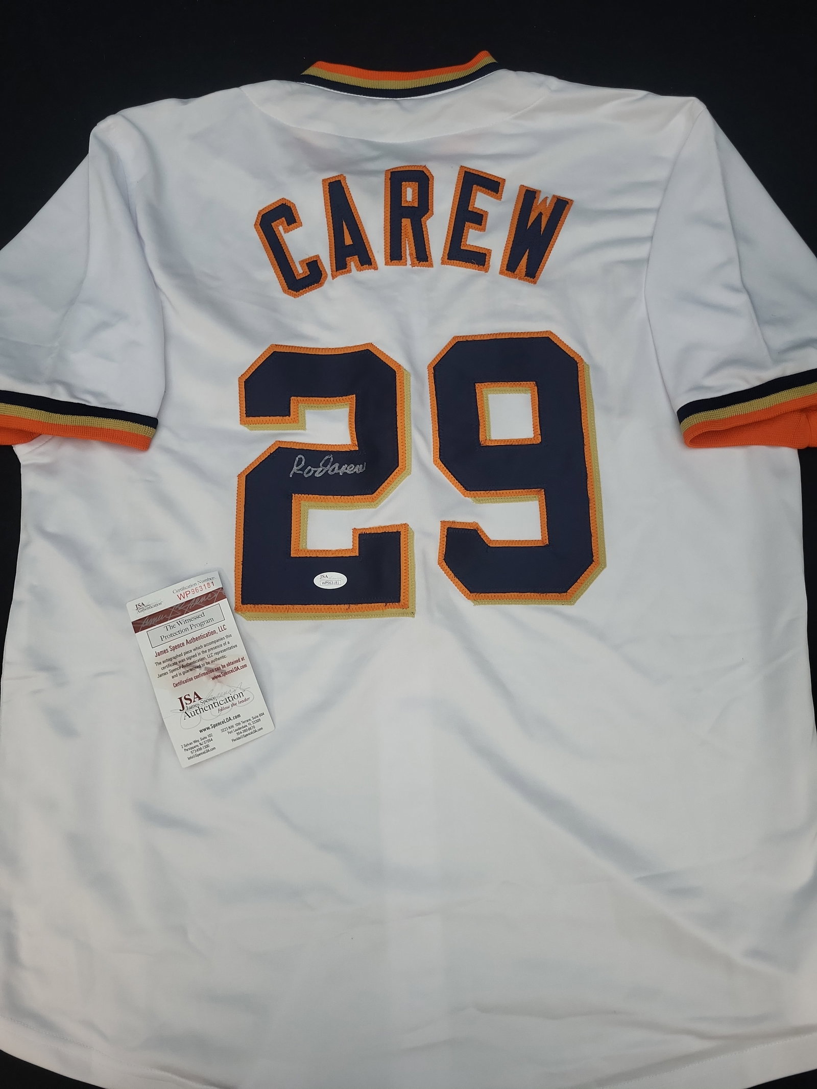 I03103 | Rod Carew Signed Minnesota Twins Custom Baseball Jersey JSA Witnessed: BID PER WHAT YOU SEE IN THE PHOTO, NOT THE AI GENERATED TITLES AND DESCRIPTIONS! Rod Carew Signed Minnesota Twins Custom Baseball Jersey JSA Witnessed This is a custom baseball jersey signed by Hall o