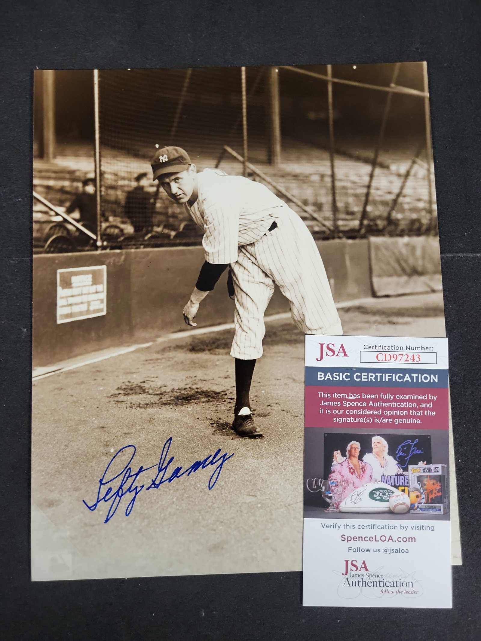 I03414 | Lefty Gomez Signed New York Yankees Photograph JSA Certified: BID PER WHAT YOU SEE IN THE PHOTO, NOT THE AI GENERATED TITLES AND DESCRIPTIONS! An autographed monochrome photograph depicting Hall of Fame pitcher Vernon Lefty Gomez of the New York Yankees in a ful