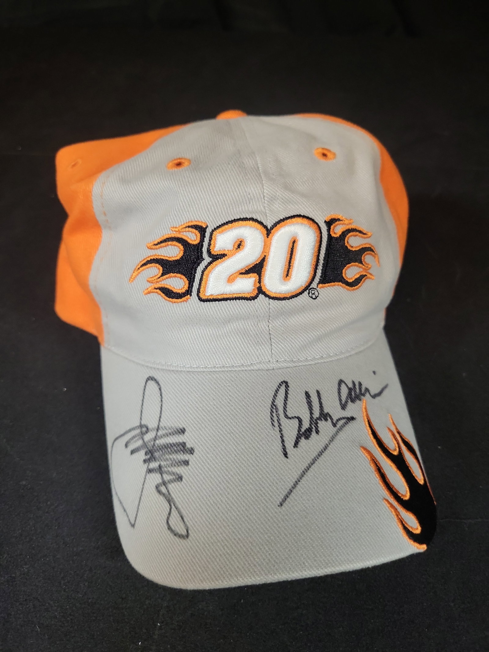 I03238 | Tony Stewart Number 20 Joe Gibbs Racing NASCAR Signed Adjustable Hat: BID PER WHAT YOU SEE IN THE PHOTO, NOT THE AI GENERATED TITLES AND DESCRIPTIONS! Attributed to Chase Authentics based on design consensus, this adjustable baseball cap is associated with NASCAR driver