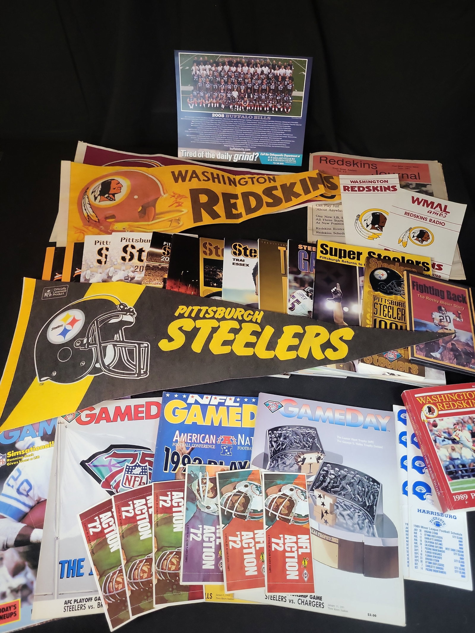 I03043 | An Assortment of NFL and Minor League Football Memorabilia Featuring Signed Washington: BID PER WHAT YOU SEE IN THE PHOTO, NOT THE AI GENERATED TITLES AND DESCRIPTIONS! An Assortment of NFL and Minor League Football Memorabilia Featuring Signed Washington Redskins Pennant A collection of