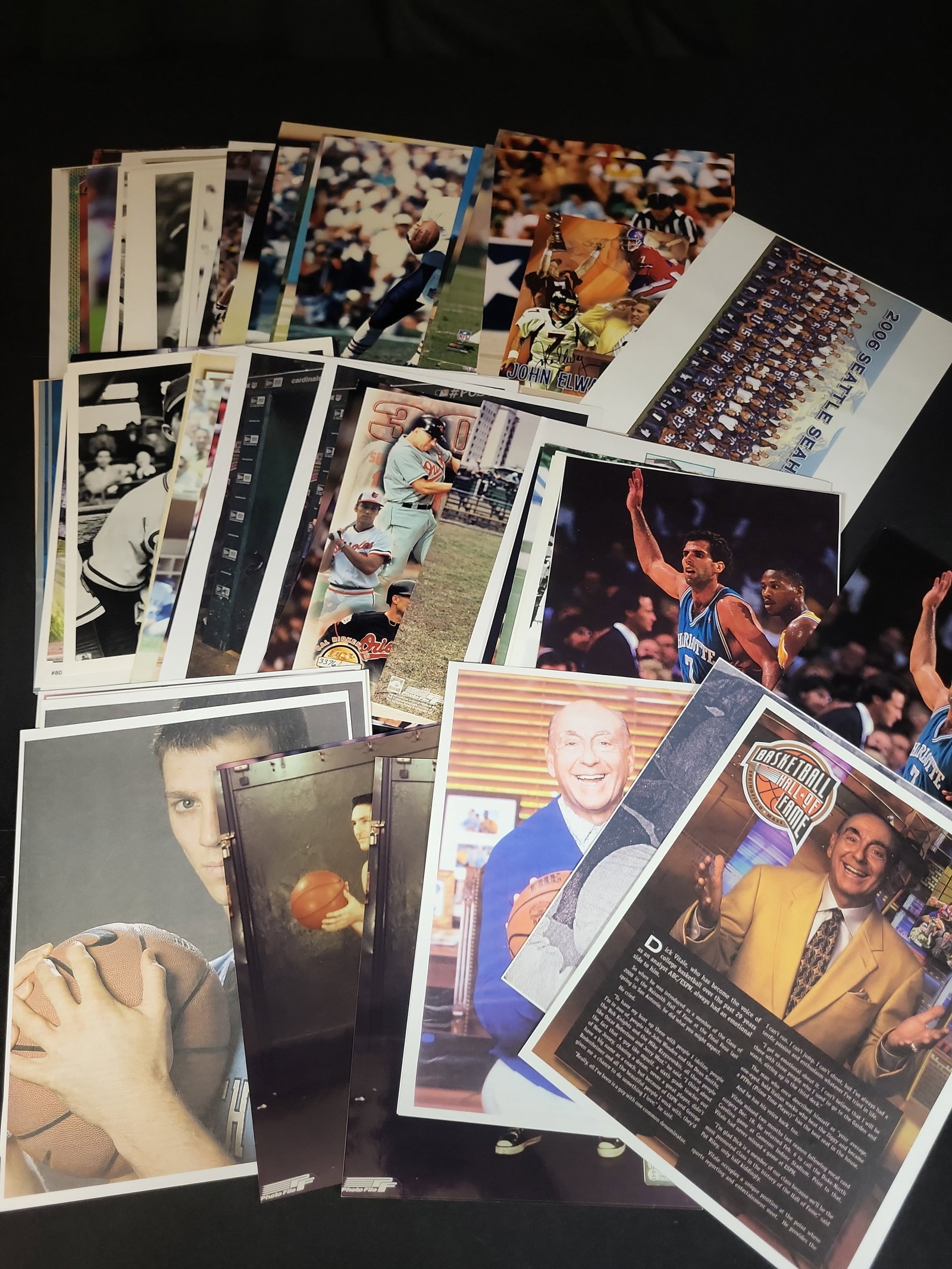 I03040 | A Collection of Professional Sports Photographs Lithographs and Promotional Prints: BID PER WHAT YOU SEE IN THE PHOTO, NOT THE AI GENERATED TITLES AND DESCRIPTIONS! A Collection of Professional Sports Photographs Lithographs and Promotional Prints This multi-sport collection contains