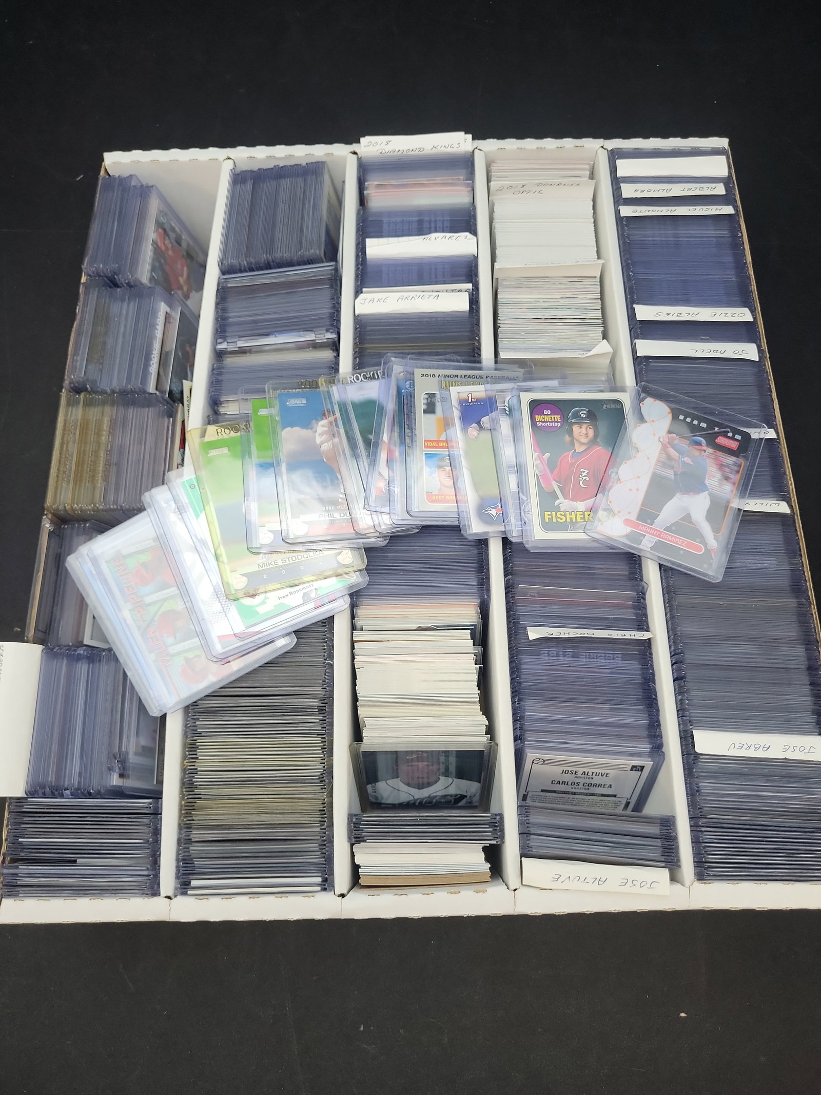 I03321 | An Assortment of Modern Baseball Trading Cards Featuring Rookies, Stars, and Inserts in: BID PER WHAT YOU SEE IN THE PHOTO, NOT THE AI GENERATED TITLES AND DESCRIPTIONS! An assortment of modern baseball trading cards primarily spanning the late 1990s through the late 2010s, organized with