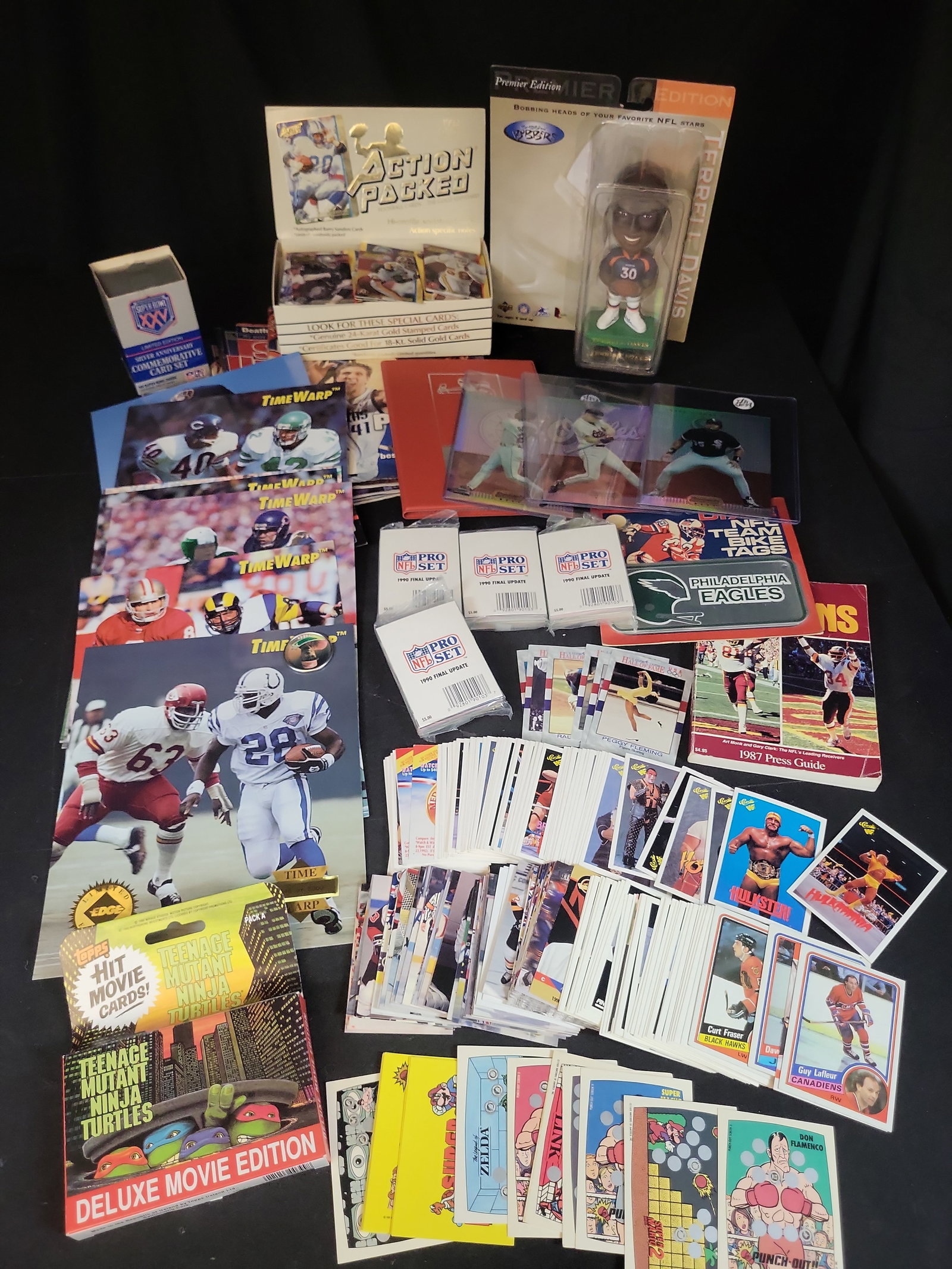 I03832 | A Collection of Vintage Sports and Pop Culture Trading Cards, Magazines, and Memorabilia: BID PER WHAT YOU SEE IN THE PHOTO, NOT THE AI GENERATED TITLES AND DESCRIPTIONS! An assortment of sports and entertainment collectibles dating primarily from the late 1980s through the early 2000s. Th