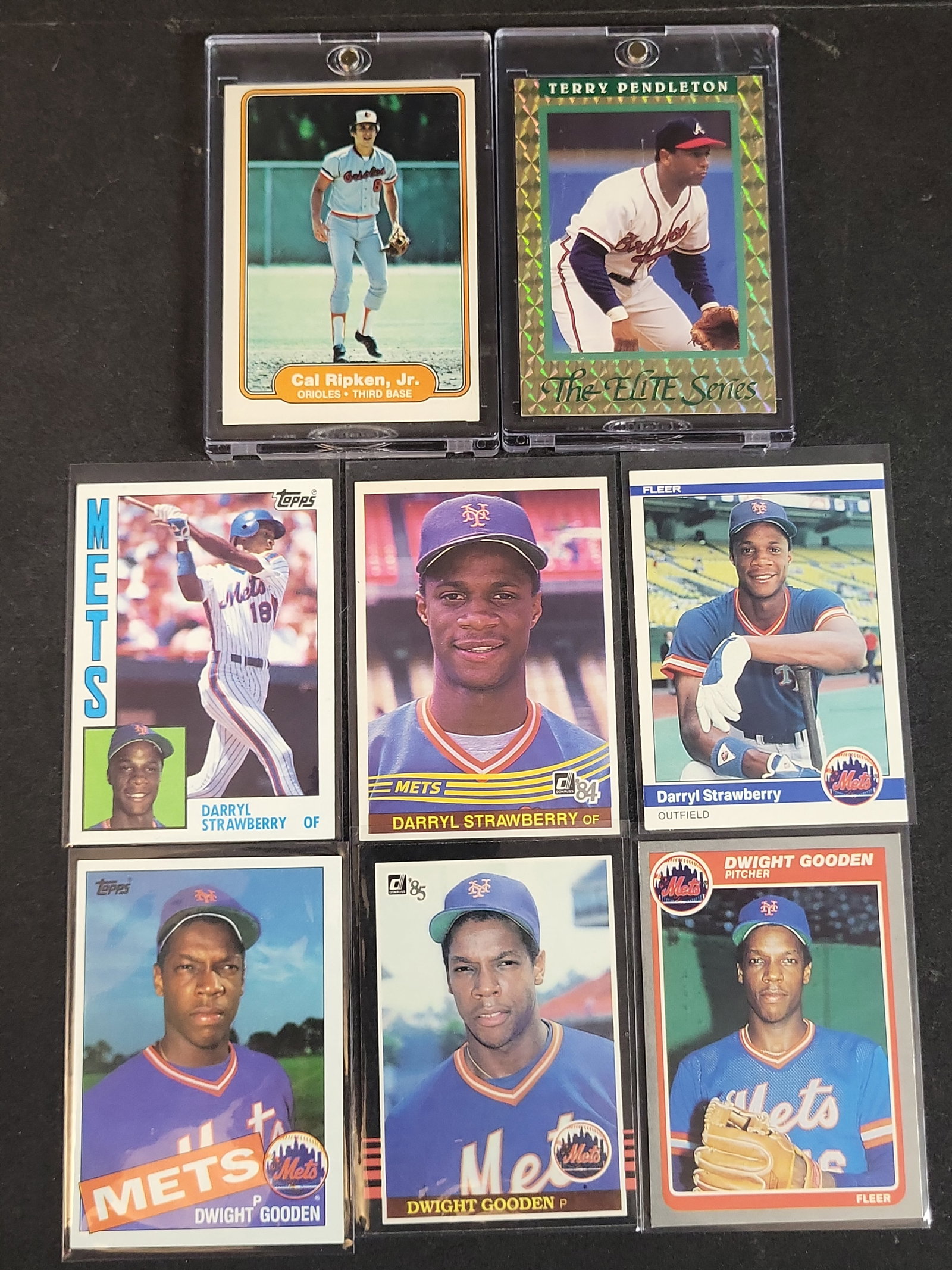 I03931 | A Collection of Vintage Baseball Trading Cards Including 1982 Fleer Cal Ripken Jr. Rookie: BID PER WHAT YOU SEE IN THE PHOTO, NOT THE AI GENERATED TITLES AND DESCRIPTIONS! An assortment of eight vintage baseball trading cards dating from 1982 to 1991. The group includes several significant 
