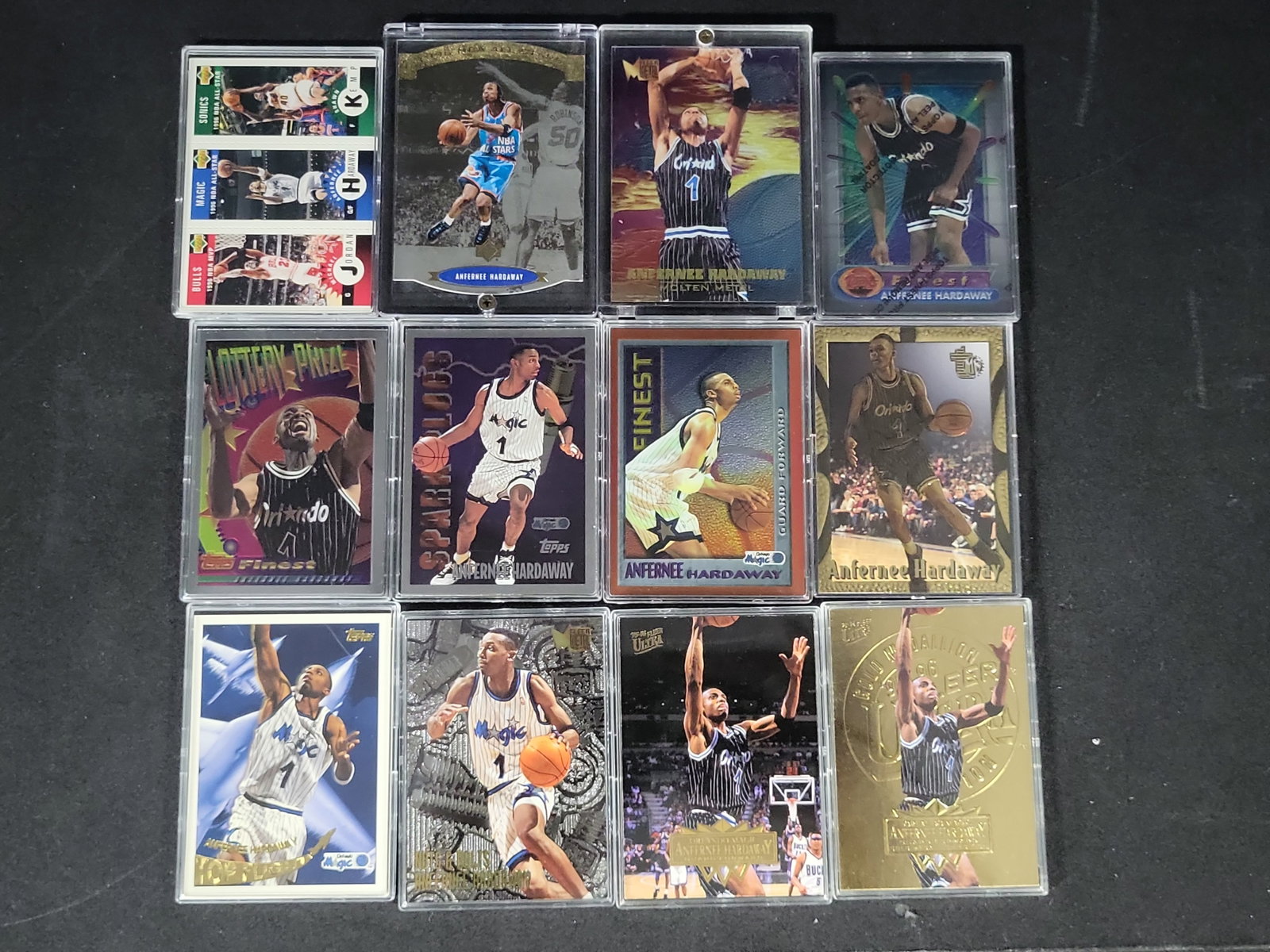 I03813 | A Collection of Mid-1990s Anfernee Penny Hardaway Basketball Trading Cards: BID PER WHAT YOU SEE IN THE PHOTO, NOT THE AI GENERATED TITLES AND DESCRIPTIONS! A collection of basketball trading cards primarily featuring Anfernee Penny Hardaway of the Orlando Magic, dating from 