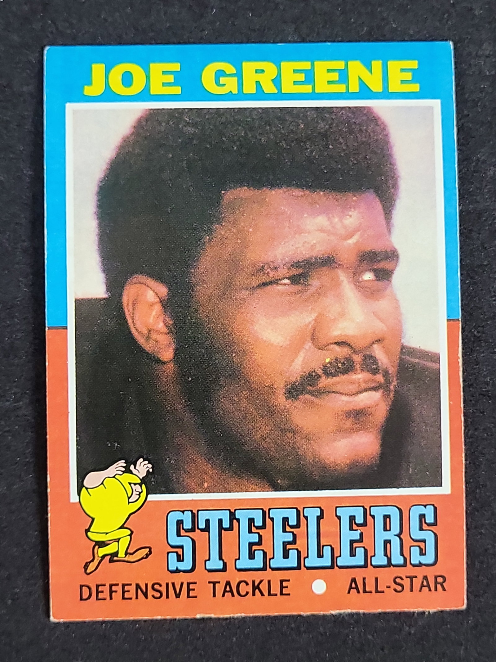 I03880 | 1971 Topps #245 Joe Greene Pittsburgh Steelers Rookie Card: BID PER WHAT YOU SEE IN THE PHOTO, NOT THE AI GENERATED TITLES AND DESCRIPTIONS! A 1971 Topps football card featuring Hall of Famer Joe Greene of the Pittsburgh Steelers, designated as card number 245