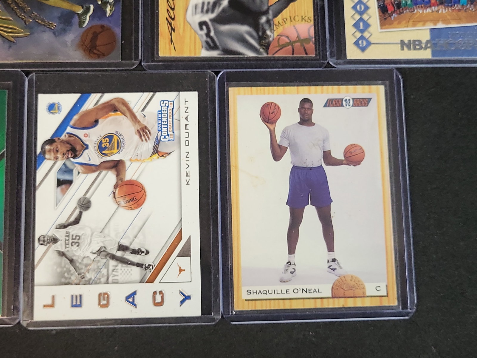 I03642 | An Assortment of Modern and Vintage-Style Basketball Trading Cards Including Panini Prizm,: BID PER WHAT YOU SEE IN THE PHOTO, NOT THE AI GENERATED TITLES AND DESCRIPTIONS! An Assortment of Modern and Vintage-Style Basketball Trading Cards Including Panini Prizm, Fleer, and Upper Deck A coll