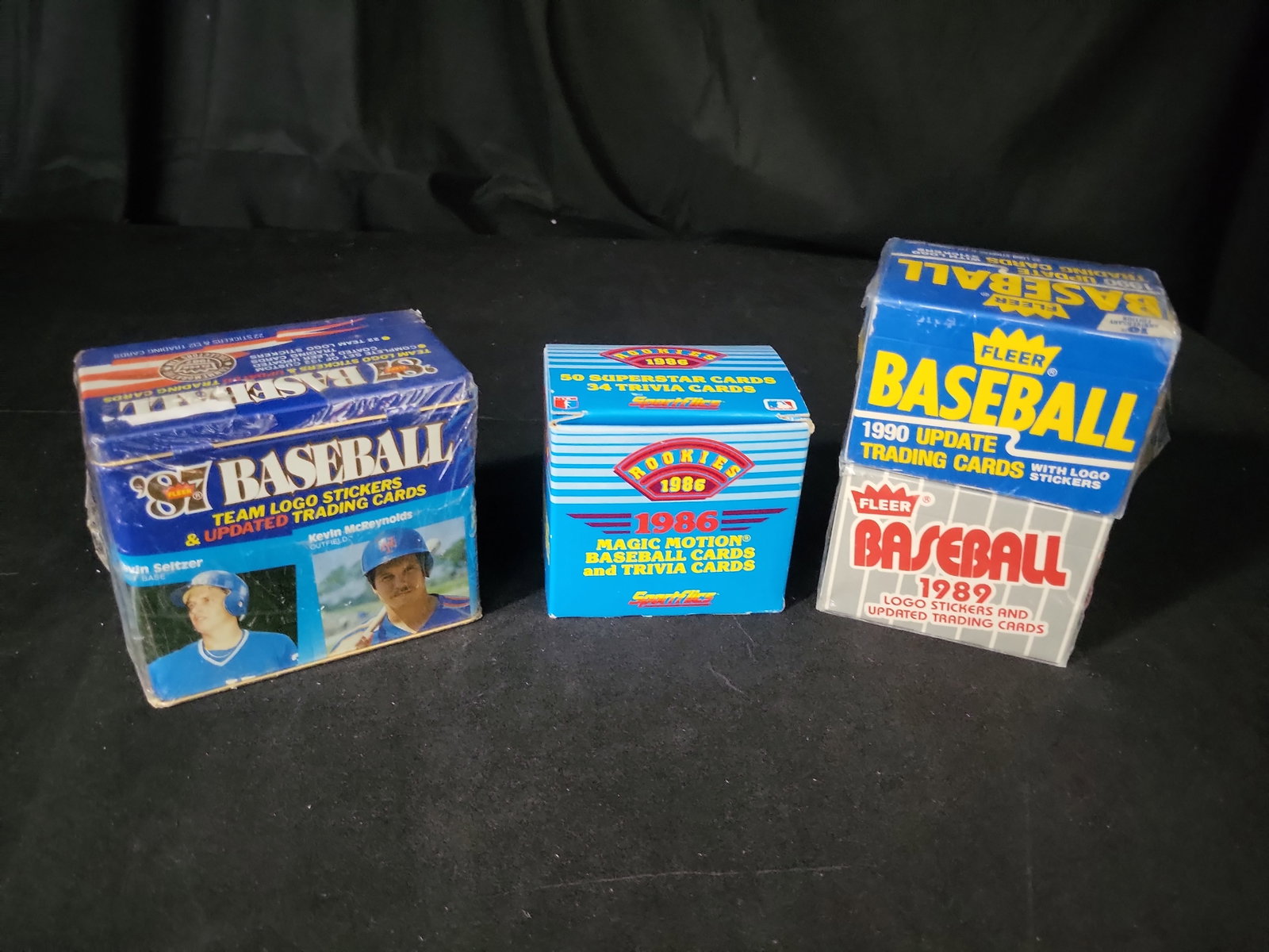I02039 | A Group of Vintage Fleer and Sportflics Baseball Card Update and Rookie Sets: BID PER WHAT YOU SEE IN THE PHOTO, NOT THE AI GENERATED TITLES AND DESCRIPTIONS! A Group of Vintage Fleer and Sportflics Baseball Card Update and Rookie Sets This collection comprises four vintage bas