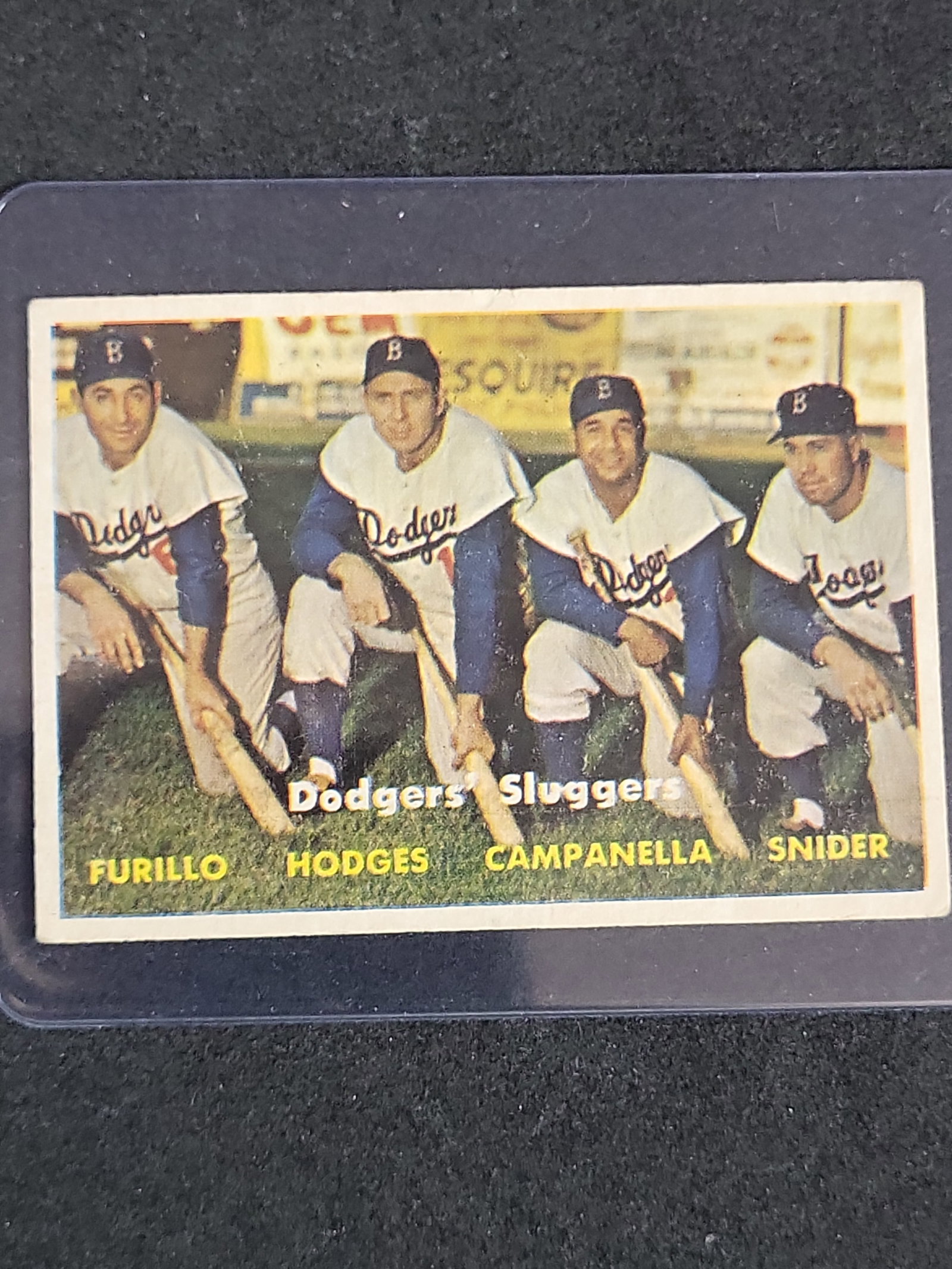 I03876 | 1957 Topps Dodgers' Sluggers Baseball Card #400: BID PER WHAT YOU SEE IN THE PHOTO, NOT THE AI GENERATED TITLES AND DESCRIPTIONS! This 1957 Topps baseball card, number 400, is titled Dodgers' Sluggers. It is a standard-sized trading card printed on 