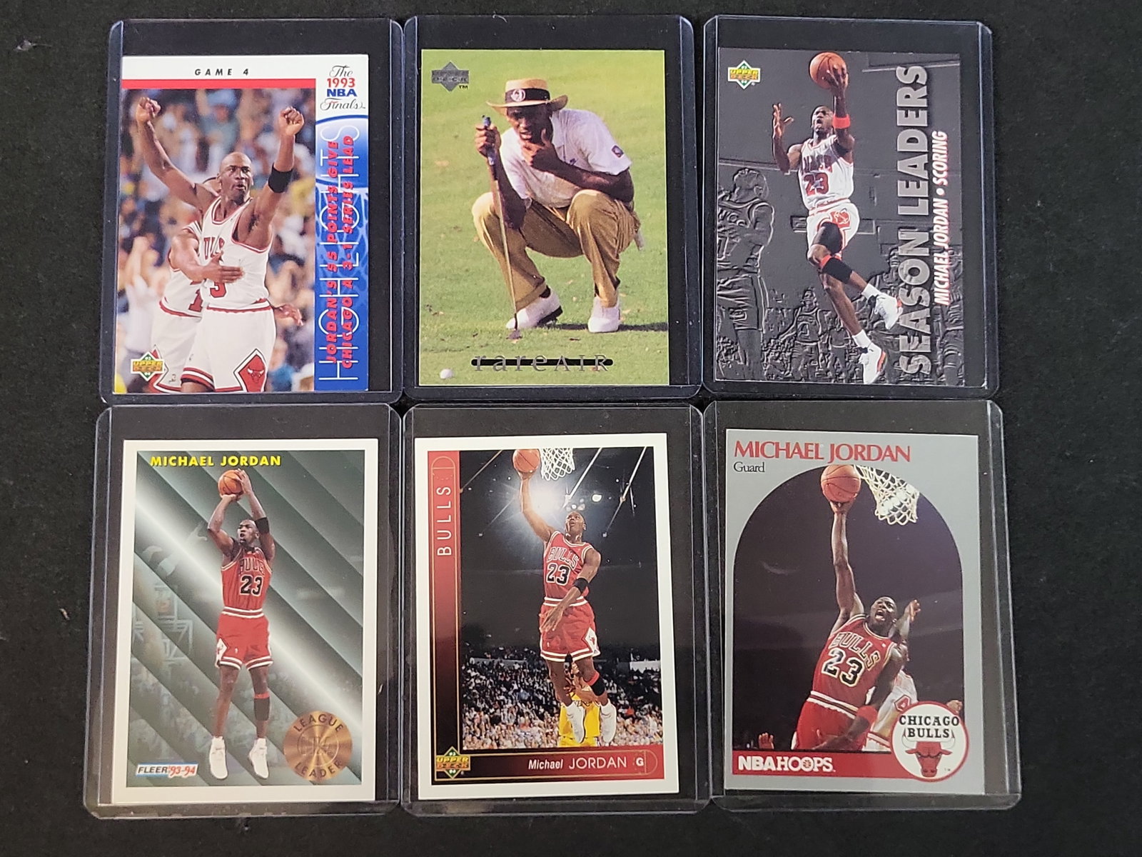 I03643 | A Collection of Six Michael Jordan Basketball Trading Cards, 1992-1994: BID PER WHAT YOU SEE IN THE PHOTO, NOT THE AI GENERATED TITLES AND DESCRIPTIONS! A Collection of Six Michael Jordan Basketball Trading Cards, 1992-1994 This collection consists of six Michael Jordan t