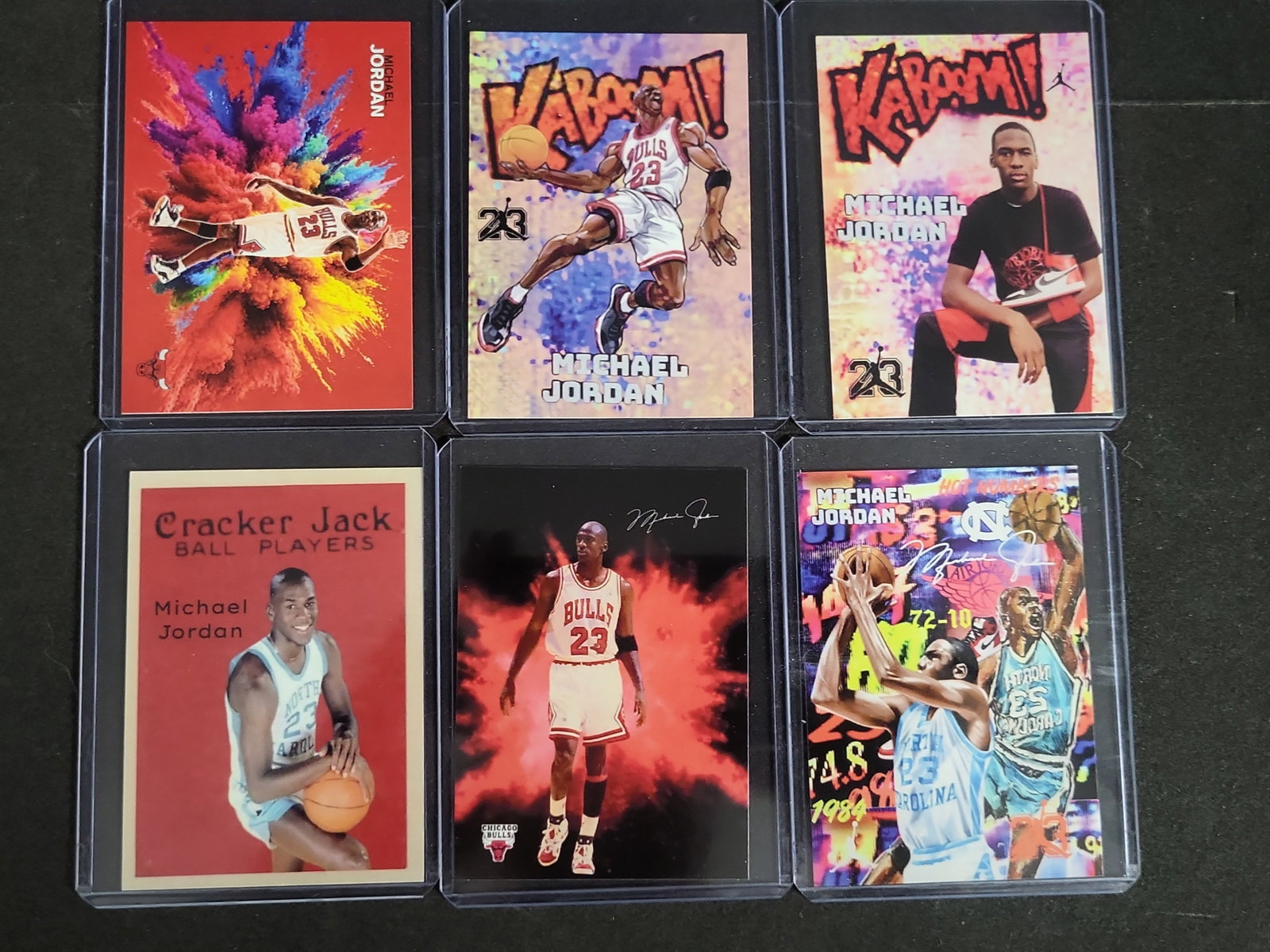 I03272 | Lot of Six Michael Jordan Custom Art and Novelty Basketball Cards Including Kaboom and: BID PER WHAT YOU SEE IN THE PHOTO, NOT THE AI GENERATED TITLES AND DESCRIPTIONS! A collection of six modern, aftermarket custom art and novelty basketball cards featuring Michael Jordan. These cards a