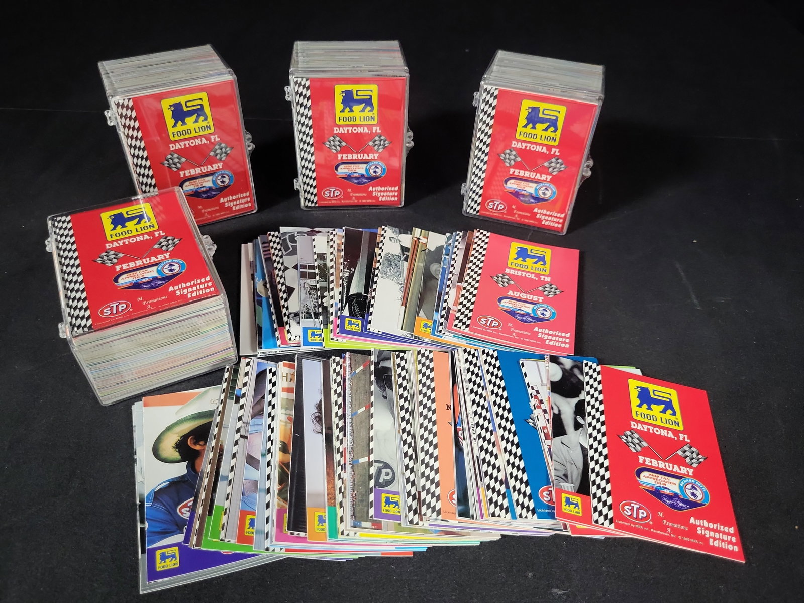 I03219 | A Collection of 1992 Food Lion and STP Richard Petty Fan Appreciation Tour Trading Cards: BID PER WHAT YOU SEE IN THE PHOTO, NOT THE AI GENERATED TITLES AND DESCRIPTIONS! This collection features multiple sets and groups of 1992 Richard Petty Fan Appreciation Tour promotional trading cards