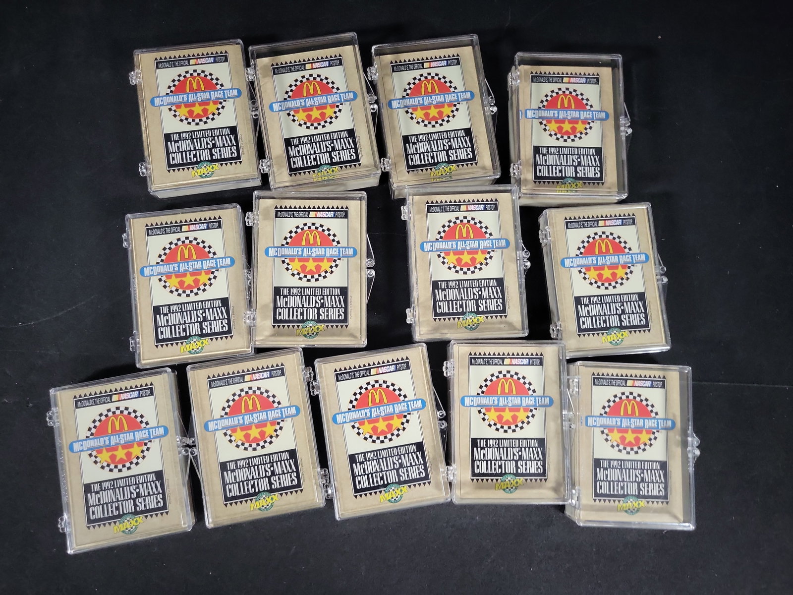 I03221 | Thirteen Sets of 1992 McDonalds-Maxx NASCAR All-Star Race Team Collector Cards: BID PER WHAT YOU SEE IN THE PHOTO, NOT THE AI GENERATED TITLES AND DESCRIPTIONS! This lot consists of thirteen sets of 1992 McDonalds-Maxx NASCAR All-Star Race Team limited edition collector cards. Pr