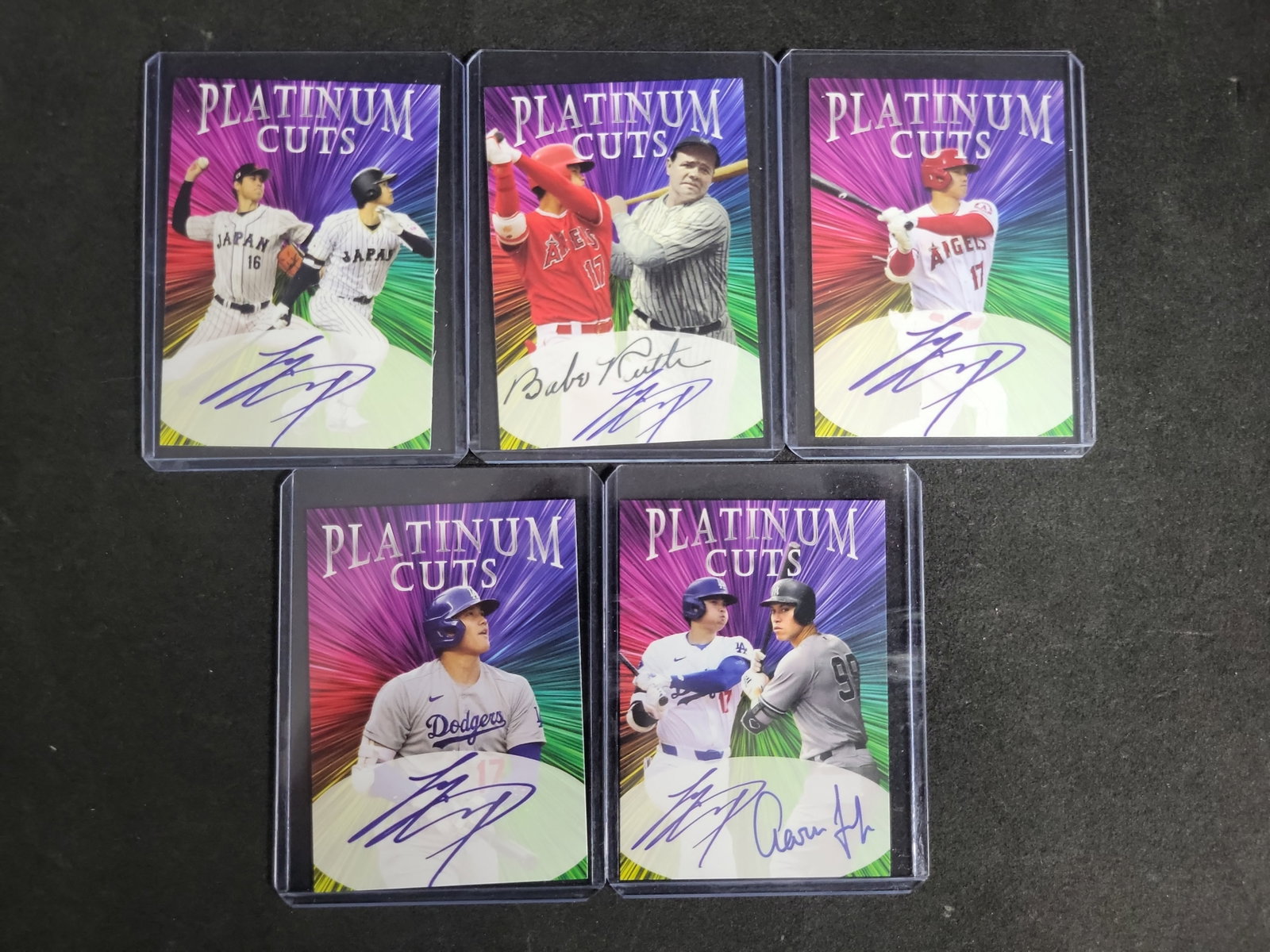 I03291 | Lot of (5) Unlicensed Platinum Cuts Facsimile Autograph Trading Cards Featuring Shohei: BID PER WHAT YOU SEE IN THE PHOTO, NOT THE AI GENERATED TITLES AND DESCRIPTIONS! A collection of five unlicensed novelty trading cards from the Platinum Cuts and Platinum Dual Cuts series. These cards