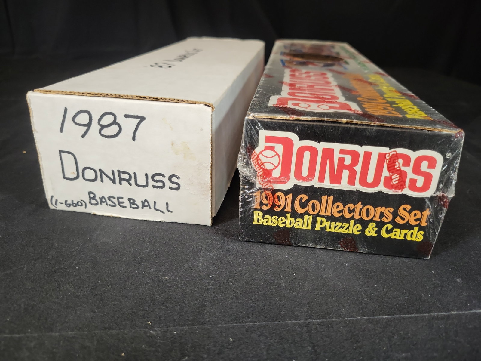 I03242 | Two Donruss Baseball Card Complete Sets, 1987 and 1991: BID PER WHAT YOU SEE IN THE PHOTO, NOT THE AI GENERATED TITLES AND DESCRIPTIONS! This lot features two complete baseball card sets produced by Donruss. The first set is a 1987 Donruss Baseball set, ho