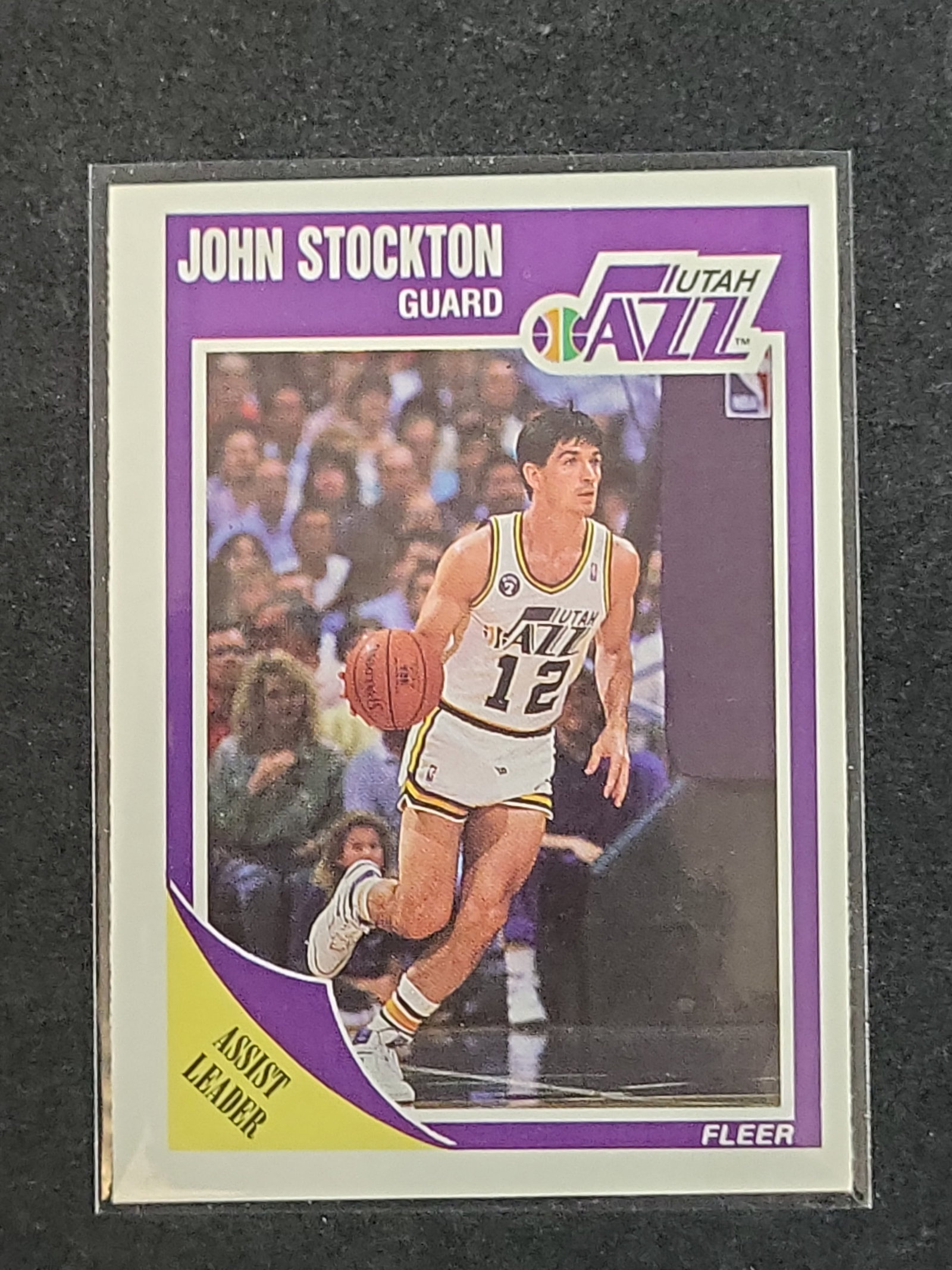 I03150 | 1989-90 Fleer John Stockton Utah Jazz Basketball Card Number 156: BID PER WHAT YOU SEE IN THE PHOTO, NOT THE AI GENERATED TITLES AND DESCRIPTIONS! 1989-90 Fleer John Stockton Utah Jazz Basketball Card Number 156 This is a 1989-90 Fleer basketball card featuring Hall