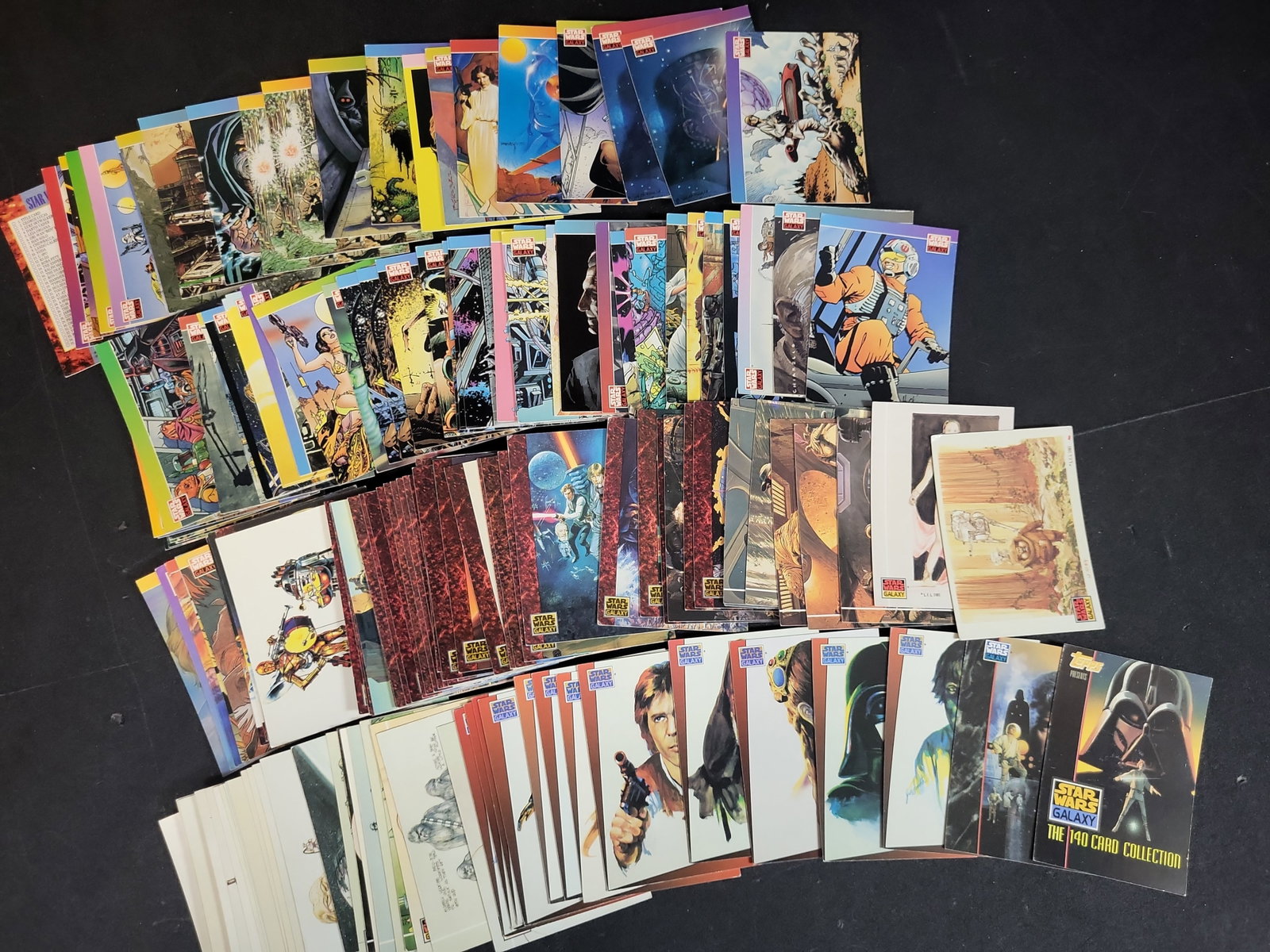 I03938 | A Collection of 1993 Topps Star Wars Galaxy Series 1 Trading Cards: BID PER WHAT YOU SEE IN THE PHOTO, NOT THE AI GENERATED TITLES AND DESCRIPTIONS! A Collection of 1993 Topps Star Wars Galaxy Series 1 Trading Cards This collection consists of multiple trading cards f