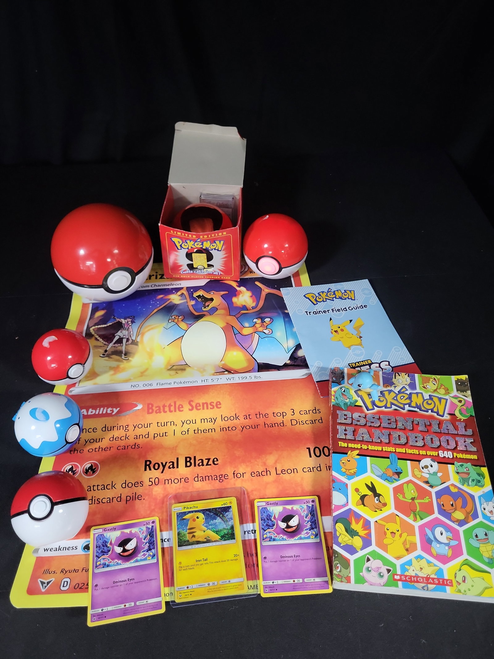 I02792 | A Collection of Pok?©mon Trading Cards and Collectibles Including 23K Gold-Plated: BID PER WHAT YOU SEE IN THE PHOTO, NOT THE AI GENERATED TITLES AND DESCRIPTIONS! A Collection of Pokémon Trading Cards and Collectibles Including 23K Gold-Plated Promotional Card and Handbooks 