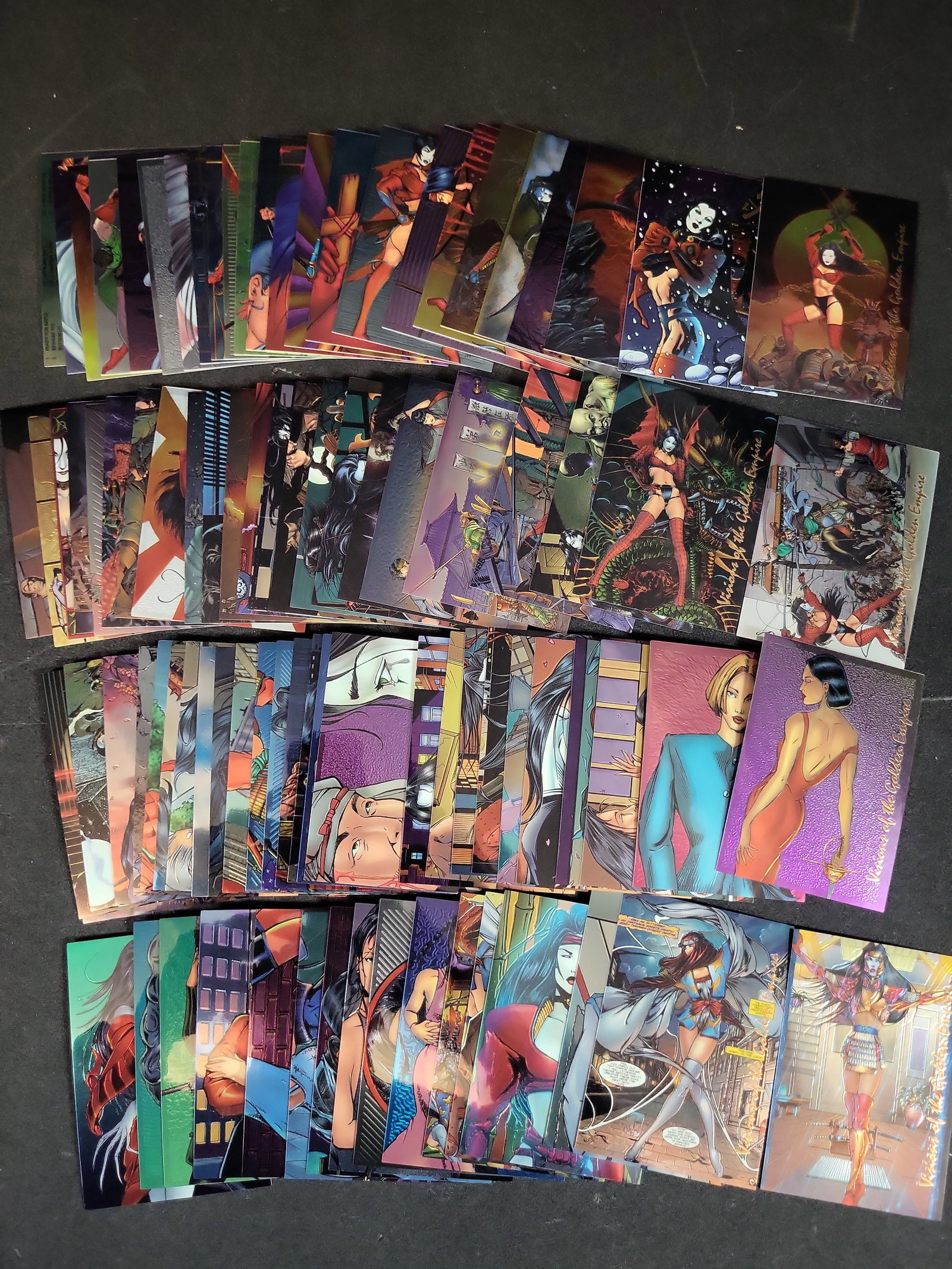 I03937 | A Collection of 1996 Shi Visions of the Golden Empire Chromium Trading Cards by Comic: BID PER WHAT YOU SEE IN THE PHOTO, NOT THE AI GENERATED TITLES AND DESCRIPTIONS! A Collection of 1996 Shi Visions of the Golden Empire Chromium Trading Cards by Comic Images This collection consists o