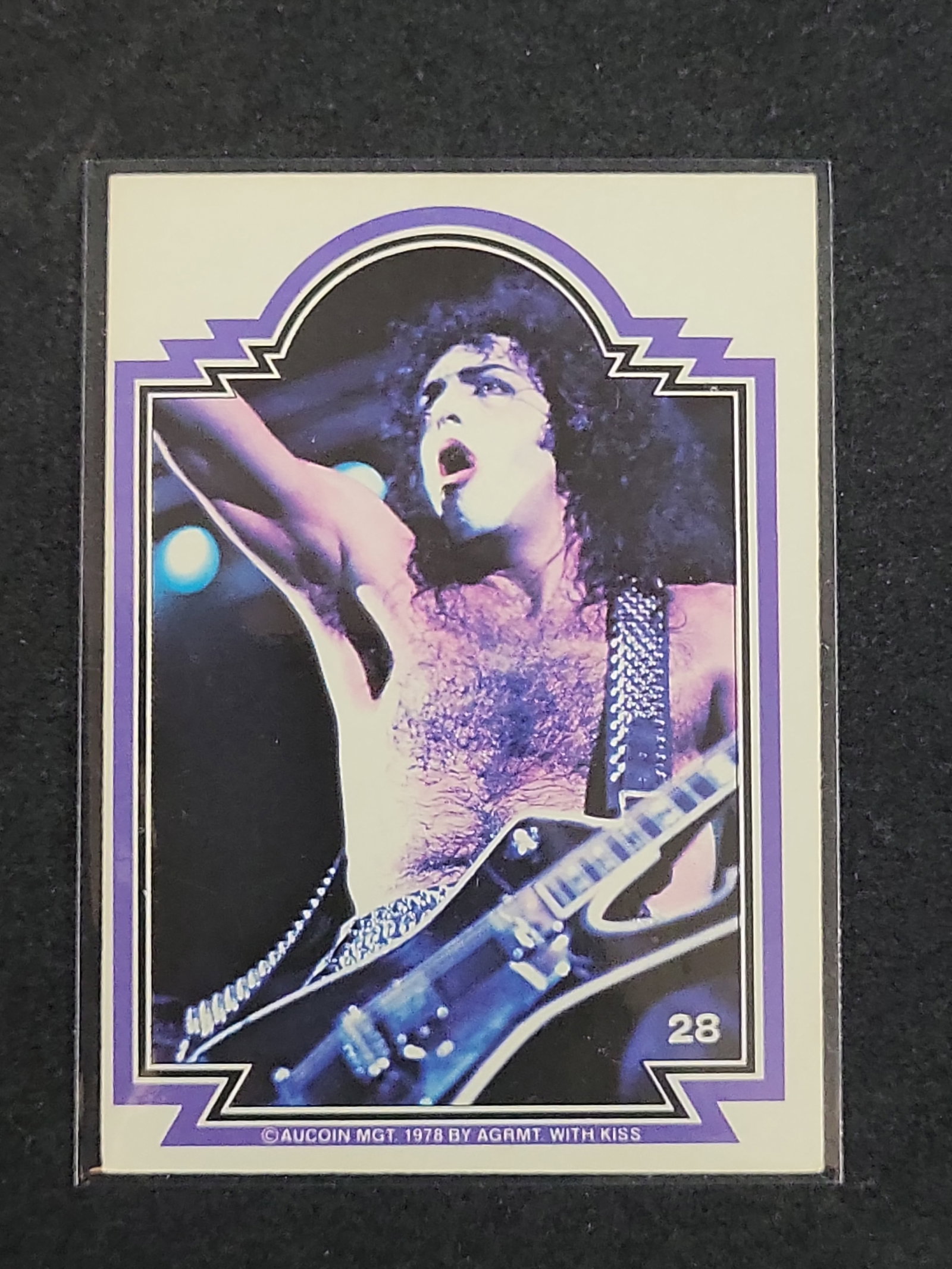 I03139 | 1978 Donruss KISS Trading Card, Paul Stanley, Number 28, Purple Border: BID PER WHAT YOU SEE IN THE PHOTO, NOT THE AI GENERATED TITLES AND DESCRIPTIONS! 1978 Donruss KISS Trading Card, Paul Stanley, Number 28, Purple Border This is an original 1978 KISS collectible tradin
