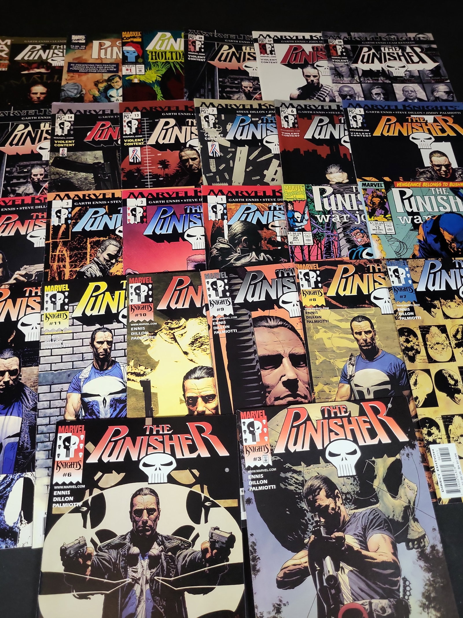 I03677 | A Collection of Approximately 27 Marvel Punisher Comic Books Featuring the Garth Ennis Run: BID PER WHAT YOU SEE IN THE PHOTO, NOT THE AI GENERATED TITLES AND DESCRIPTIONS! A Collection of Approximately 27 Marvel Punisher Comic Books Featuring the Garth Ennis Run This collection contains an 