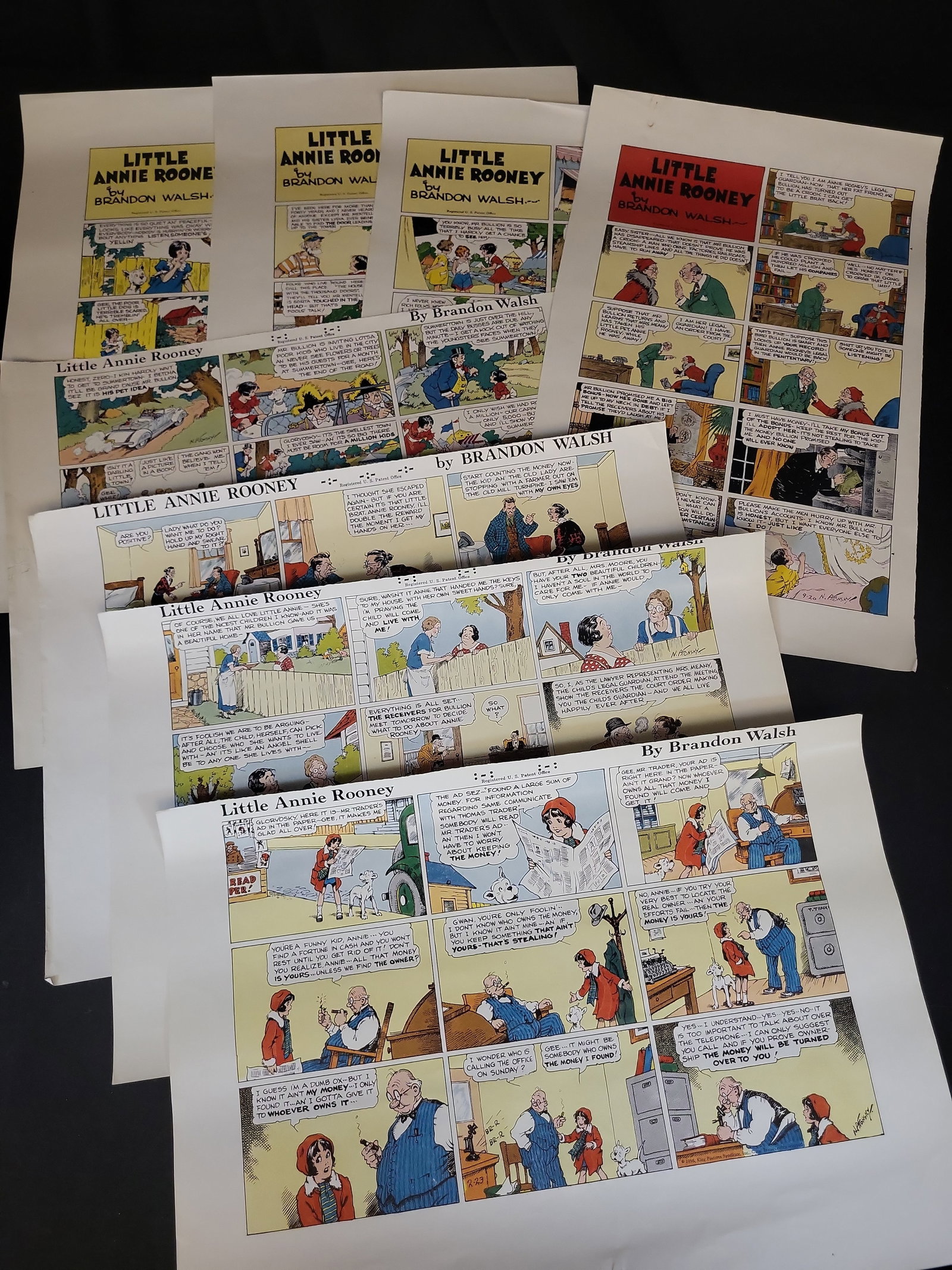 I03466 | Group of Eight Little Annie Rooney Sunday Comic Strip Proof Sheets ca 1935-1936: BID PER WHAT YOU SEE IN THE PHOTO, NOT THE AI GENERATED TITLES AND DESCRIPTIONS! This lot features a collection of eight large-format, single-sided color comic strip proof or reprint sheets of the cla