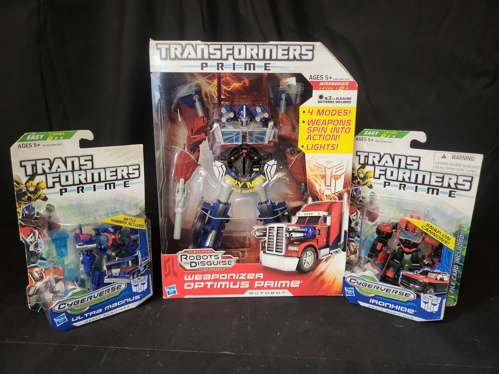 I03518 | A Trio of Hasbro Transformers Prime Action Figures including Weaponizer Optimus Prime (1 of 8)