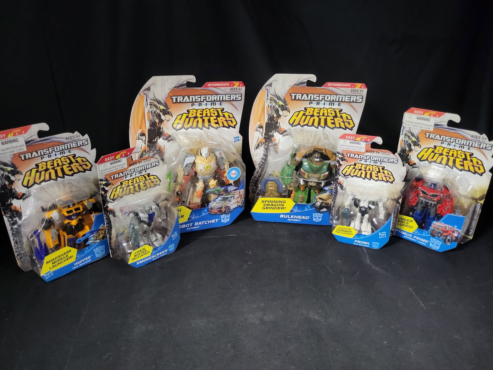 I03523 | A Lot of Six Transformers Prime Beast Hunters Action Figures by Hasbro: BID PER WHAT YOU SEE IN THE PHOTO, NOT THE AI GENERATED TITLES AND DESCRIPTIONS! A Lot of Six Transformers Prime Beast Hunters Action Figures by Hasbro A collection of six factory-sealed Transformers 