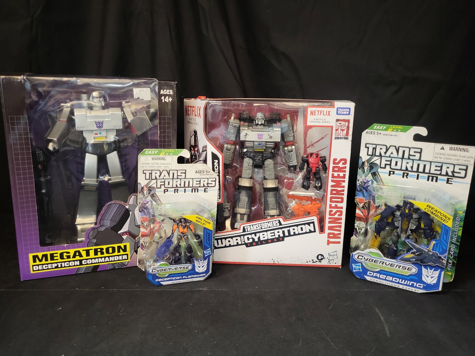 I03502 | A Collection of Four Hasbro and PCS Collectibles Transformers Action Figures in Original (1 of 11)