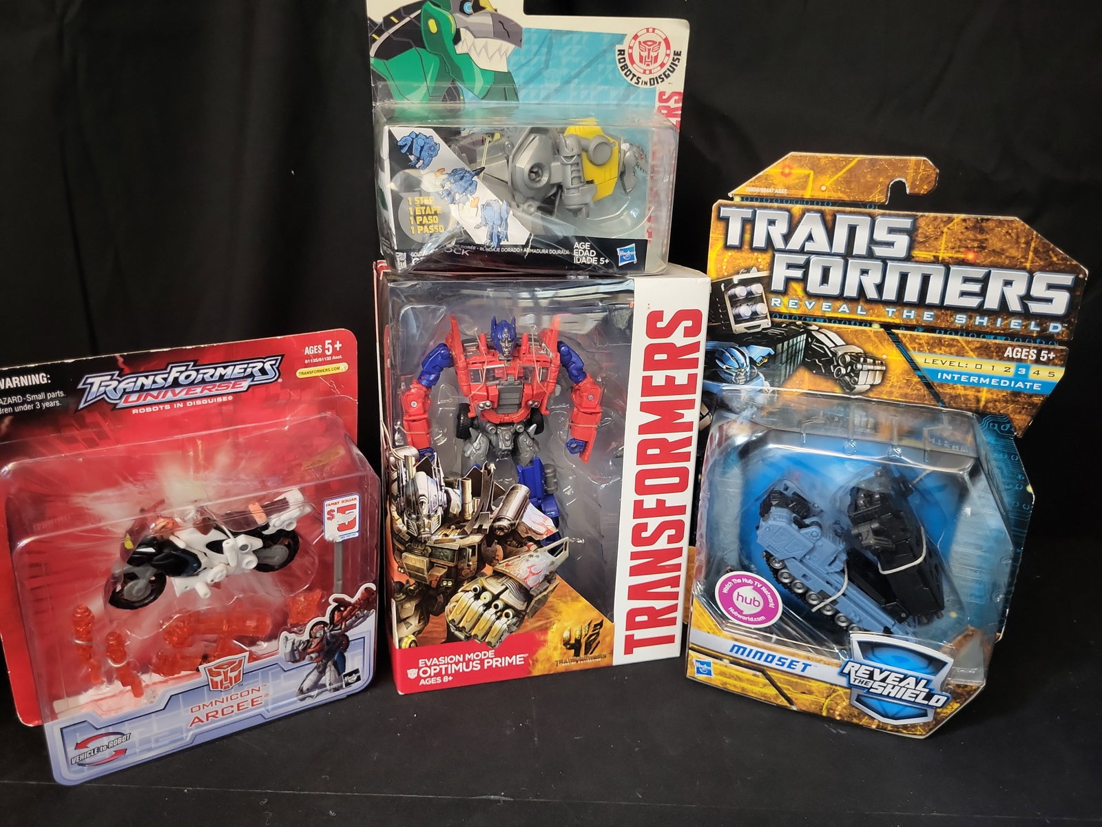 I03505 | Four Hasbro Transformers Action Figures Including Optimus Prime Arcee Mindset and Grimlock (1 of 12)