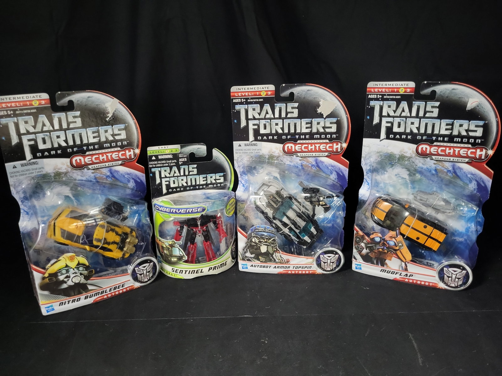 I03525 | A Collection of Four Hasbro Transformers Dark of the Moon Action Figures in Original (1 of 7)