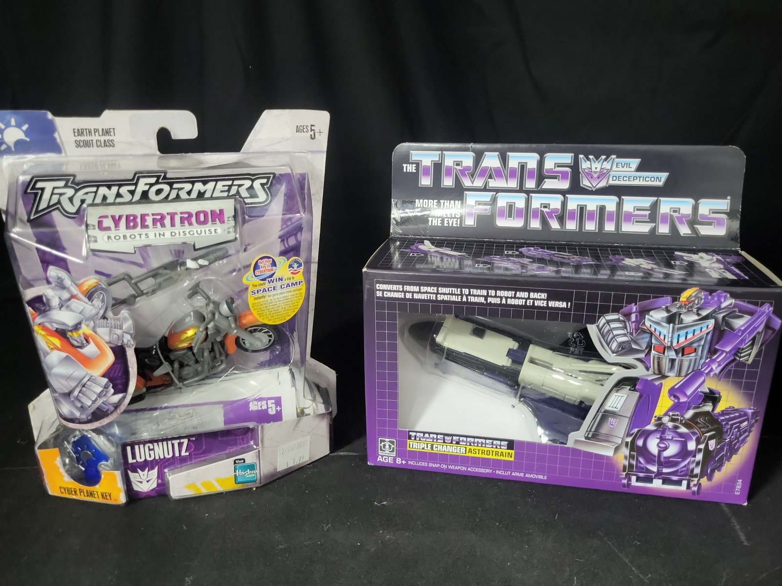 I03540 | Two Hasbro Transformers Action Figures, Cybertron Lugnutz and Vintage G1 Reissue Astrotrain (1 of 5)