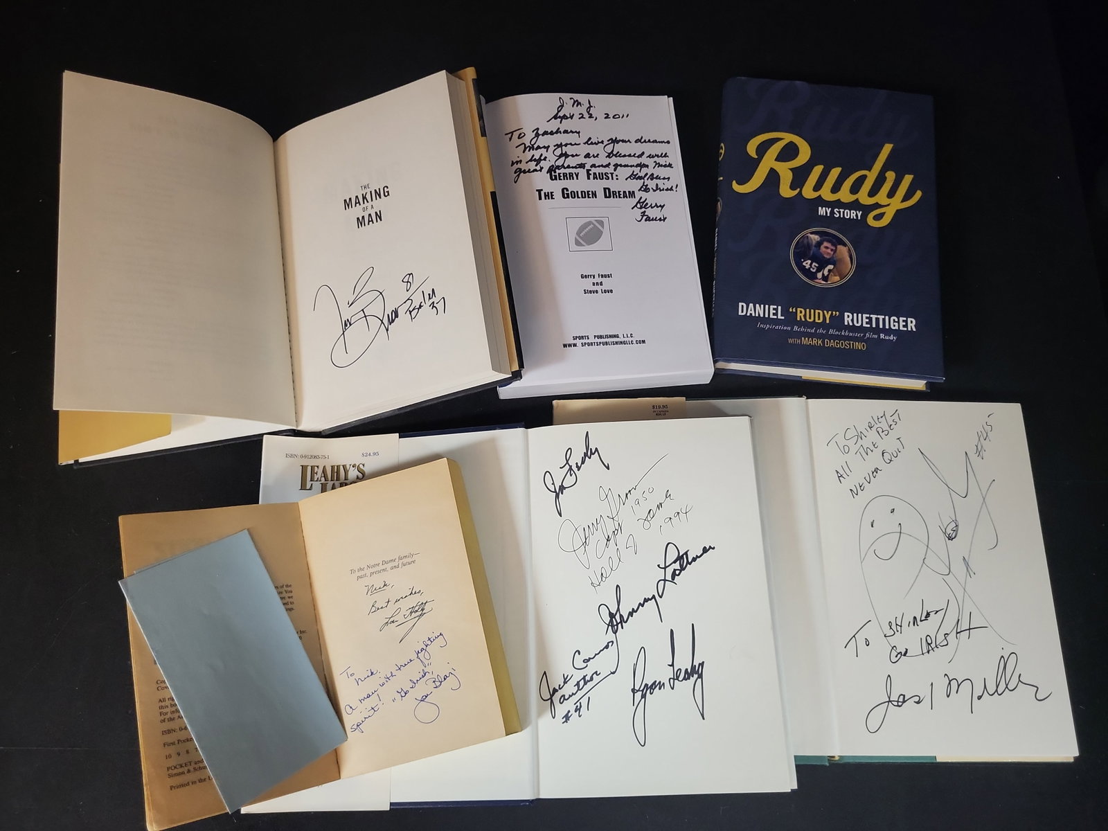 I03061 | A Collection of Notre Dame Football Volumes (Signed) (DJ): BID PER WHAT YOU SEE IN THE PHOTO, NOT THE AI GENERATED TITLES AND DESCRIPTIONS! A Collection of Notre Dame Football Volumes (Signed) (DJ) This lot comprises a collection of hardcover and softcover vo