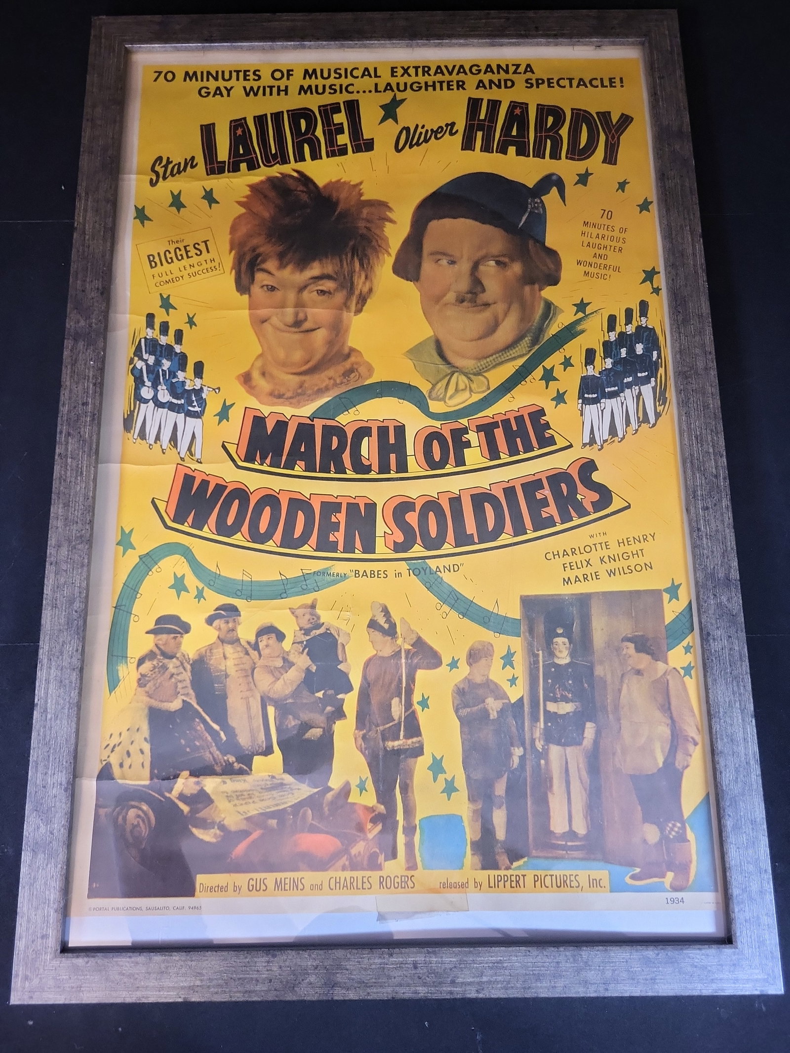 I03895 | Framed March of the Wooden Soldiers Laurel and Hardy Movie Poster Reproduction: BID PER WHAT YOU SEE IN THE PHOTO, NOT THE AI GENERATED TITLES AND DESCRIPTIONS! This is a framed commercial reproduction of the movie poster for the 1934 film March of the Wooden Soldiers, starring S