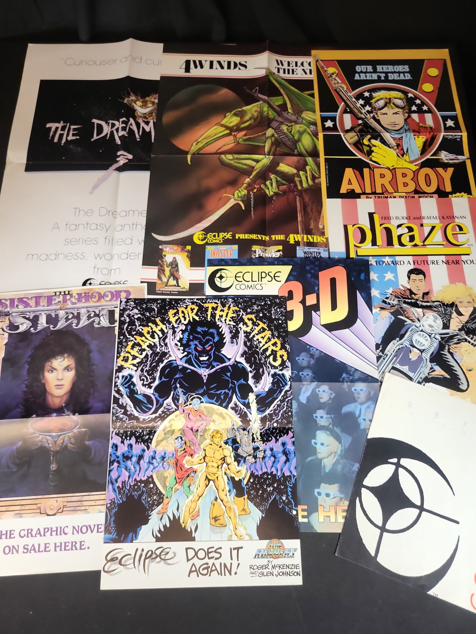 I03911 | An Assortment of Eclipse Comics Promotional Posters and 1987-1988 Catalog: BID PER WHAT YOU SEE IN THE PHOTO, NOT THE AI GENERATED TITLES AND DESCRIPTIONS! An assortment of promotional material and ephemera from Eclipse Comics, produced between 1986 and 1988. The collection 