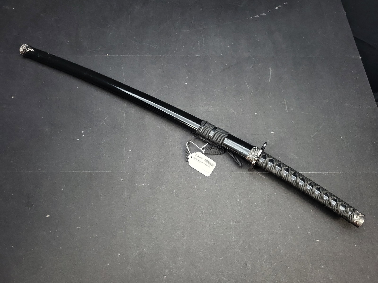 I04732 | Decorative Japanese Style Katana Replica: IMPORTANT â€“ PLEASE REVIEW BEFORE BIDDING: Aeron House makes every effort to accurately identify and describe each lot; however, titles and descriptions may contain errors, omissions, or AI-a