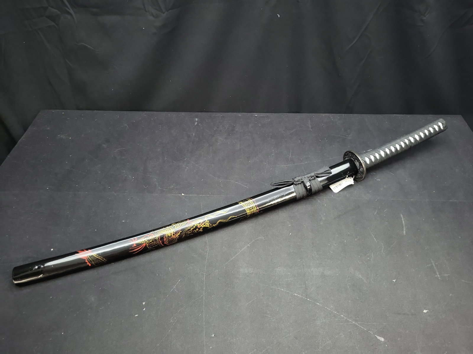 I04733 | Replica Decorative Dragon Motif Katana: IMPORTANT â€“ PLEASE REVIEW BEFORE BIDDING: Aeron House makes every effort to accurately identify and describe each lot; however, titles and descriptions may contain errors, omissions, or AI-a