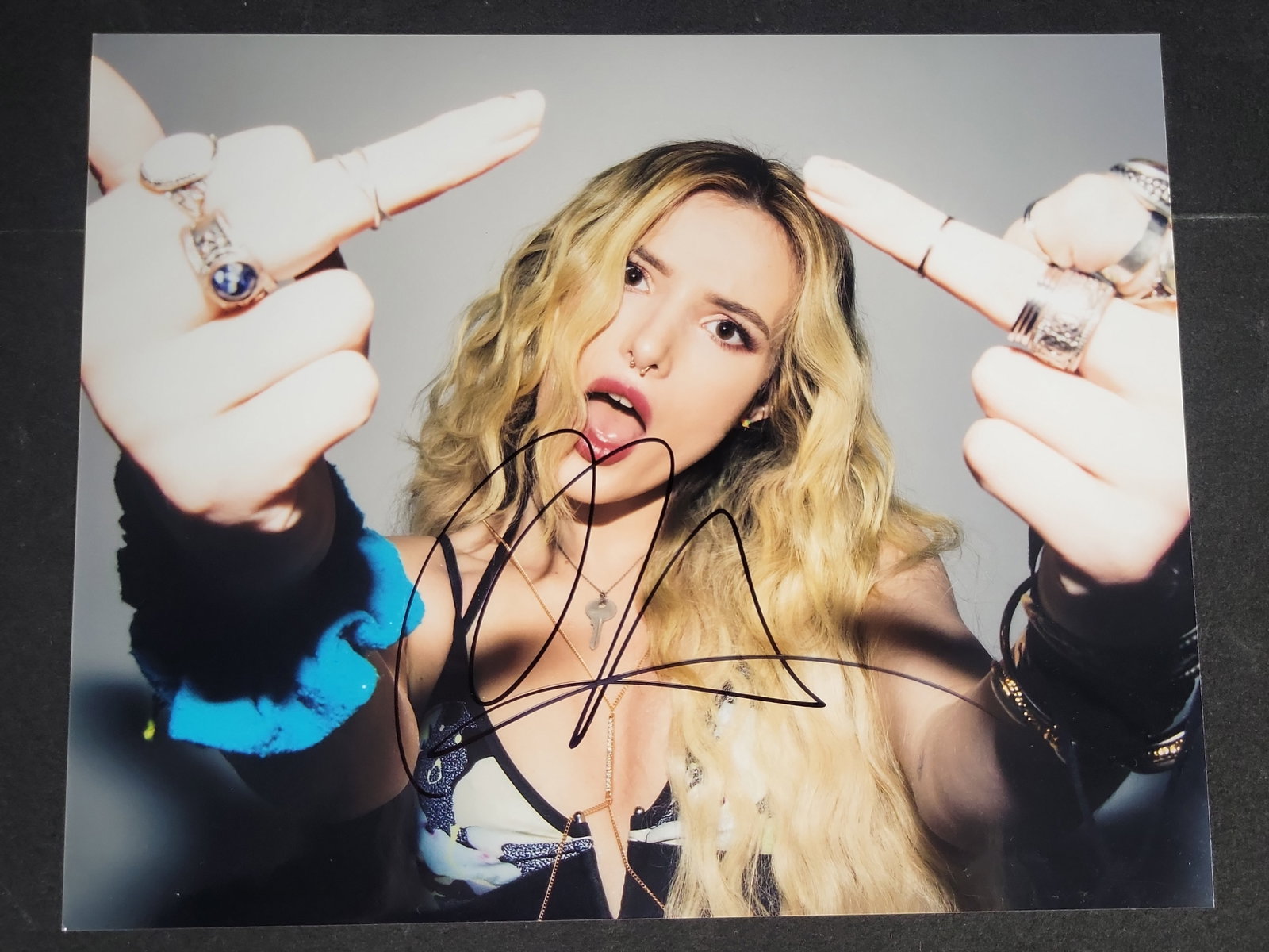 I04409 | Bella Thorne Autographed Color Photograph: IMPORTANT â€“ PLEASE REVIEW BEFORE BIDDING: Aeron House makes every effort to accurately identify and describe each lot; however, titles and descriptions may contain errors, omissions, or AI-a