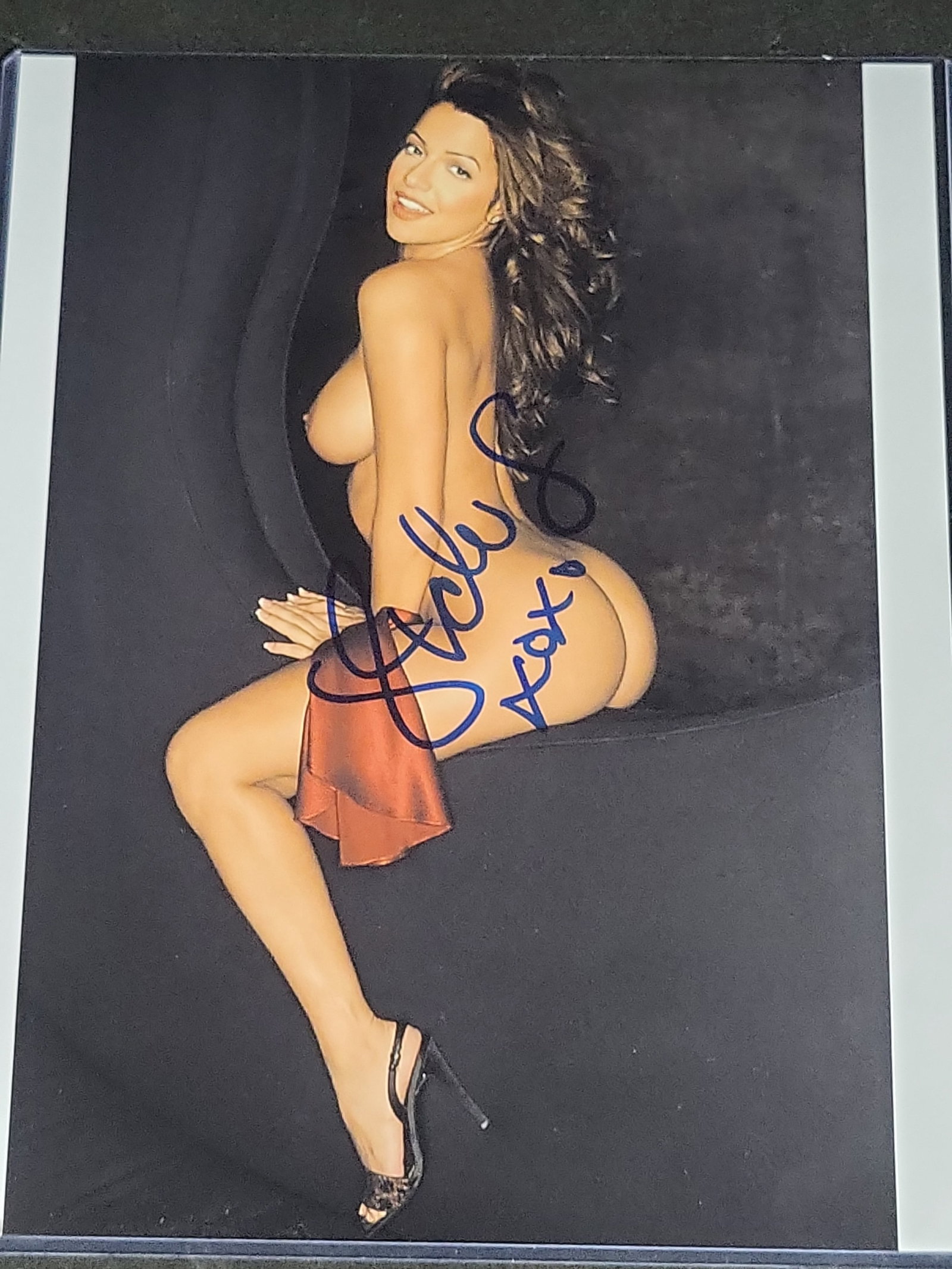 I04438 | Signed Vida Guerra Color Photograph: IMPORTANT â€“ PLEASE REVIEW BEFORE BIDDING: Aeron House makes every effort to accurately identify and describe each lot; however, titles and descriptions may contain errors, omissions, or AI-a