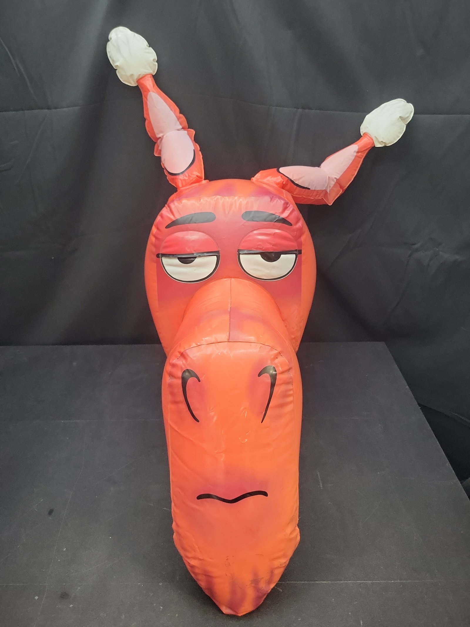 I04319 | Inflatable Red Character Promotional Figure: IMPORTANT â€“ PLEASE REVIEW BEFORE BIDDING: Aeron House makes every effort to accurately identify and describe each lot; however, titles and descriptions may contain errors, omissions, or AI-a