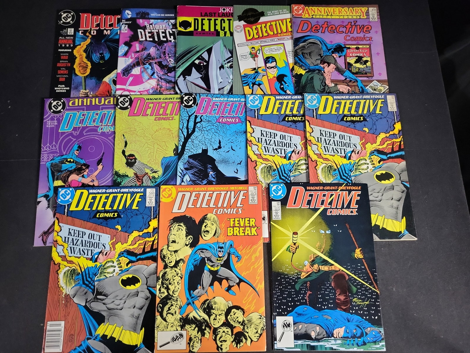 I04534 | A Collection of Thirteen Detective Comics: IMPORTANT â€“ PLEASE REVIEW BEFORE BIDDING: Aeron House makes every effort to accurately identify and describe each lot; however, titles and descriptions may contain errors, omissions, or AI-a