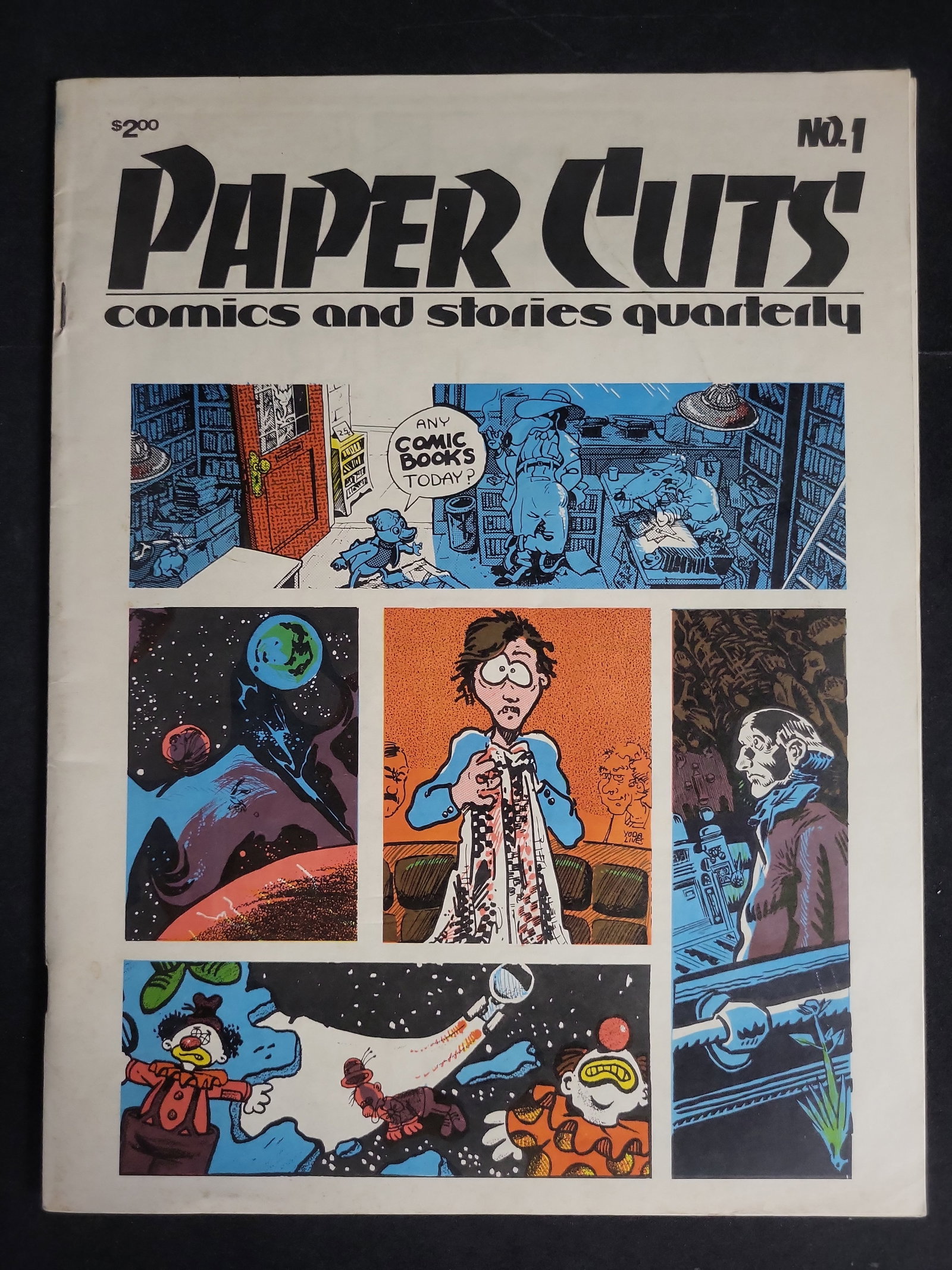 I04051 | Paper Cuts Comics Quarterly No. 1: IMPORTANT â€“ PLEASE REVIEW BEFORE BIDDING: Aeron House makes every effort to accurately identify and describe each lot; however, titles and descriptions may contain errors, omissions, or AI-a