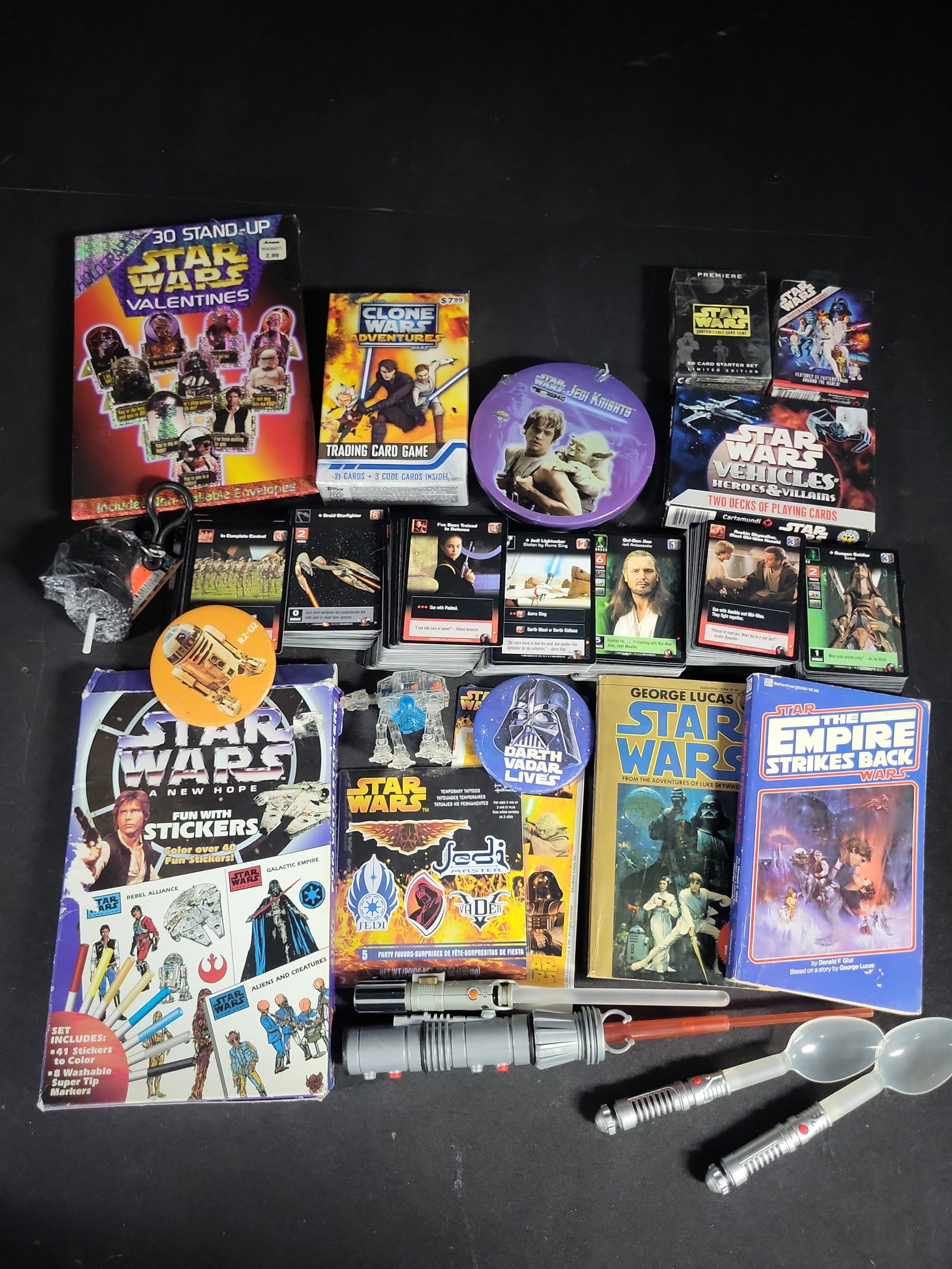 I04691 | Assorted Star Wars Trading Cards and Collectibles: IMPORTANT â€“ PLEASE REVIEW BEFORE BIDDING: Aeron House makes every effort to accurately identify and describe each lot; however, titles and descriptions may contain errors, omissions, or AI-a