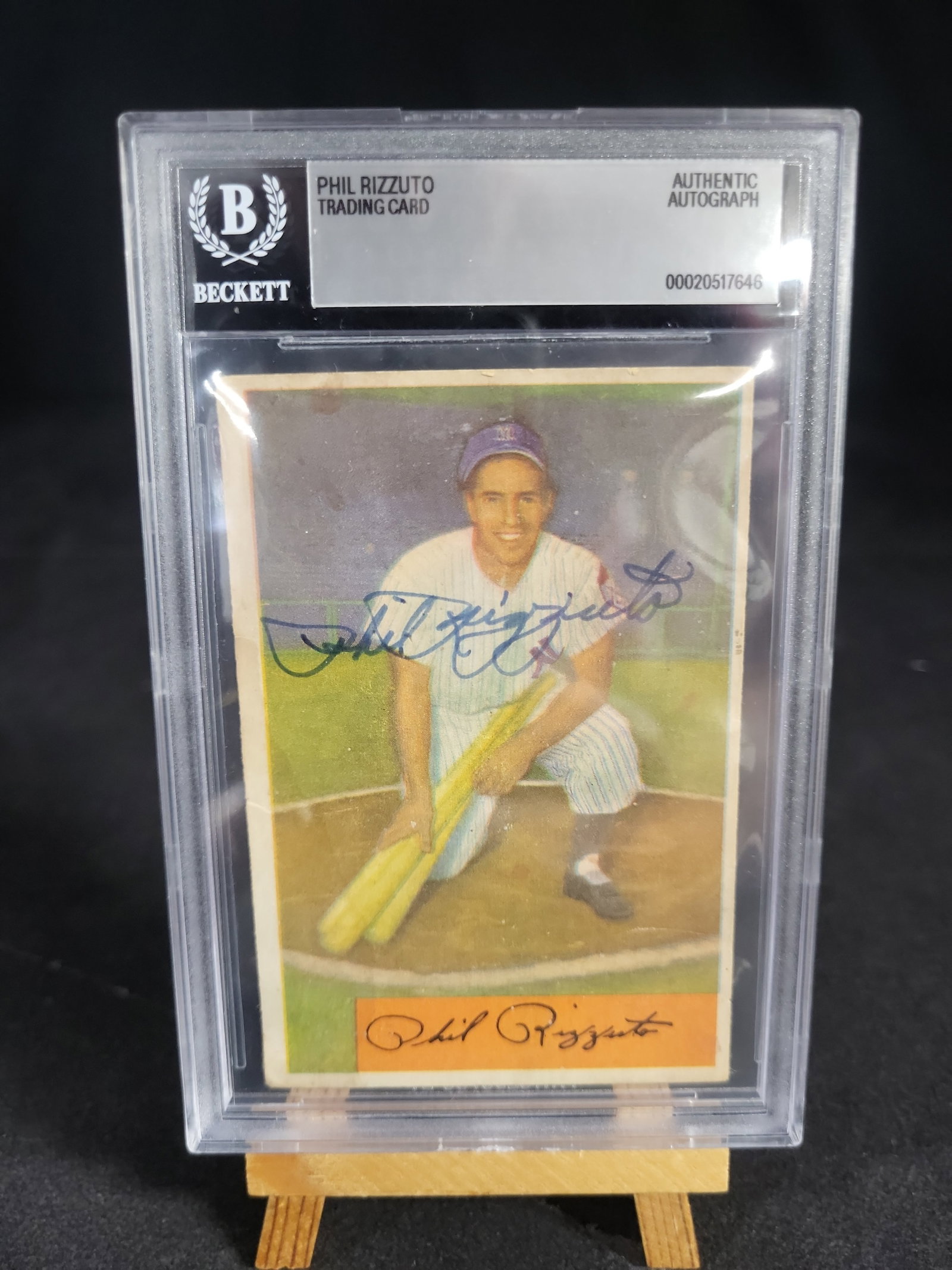 I04210 | Autographed 1954 Bowman Phil Rizzuto Card Beckett: IMPORTANT â€“ PLEASE REVIEW BEFORE BIDDING: Aeron House makes every effort to accurately identify and describe each lot; however, titles and descriptions may contain errors, omissions, or AI-a