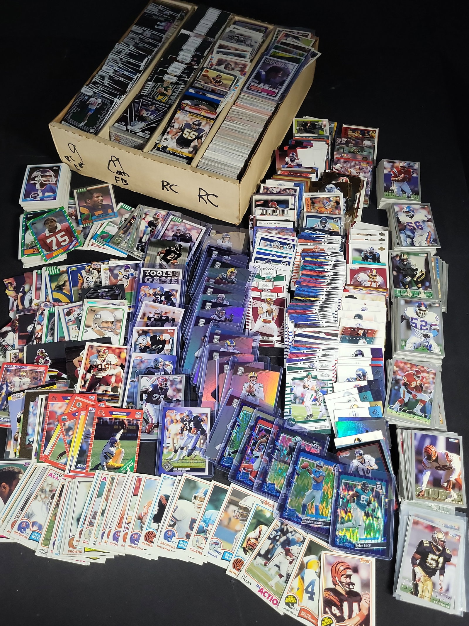 I04654 | Large Football Trading Card Collection: IMPORTANT â€“ PLEASE REVIEW BEFORE BIDDING: Aeron House makes every effort to accurately identify and describe each lot; however, titles and descriptions may contain errors, omissions, or AI-a