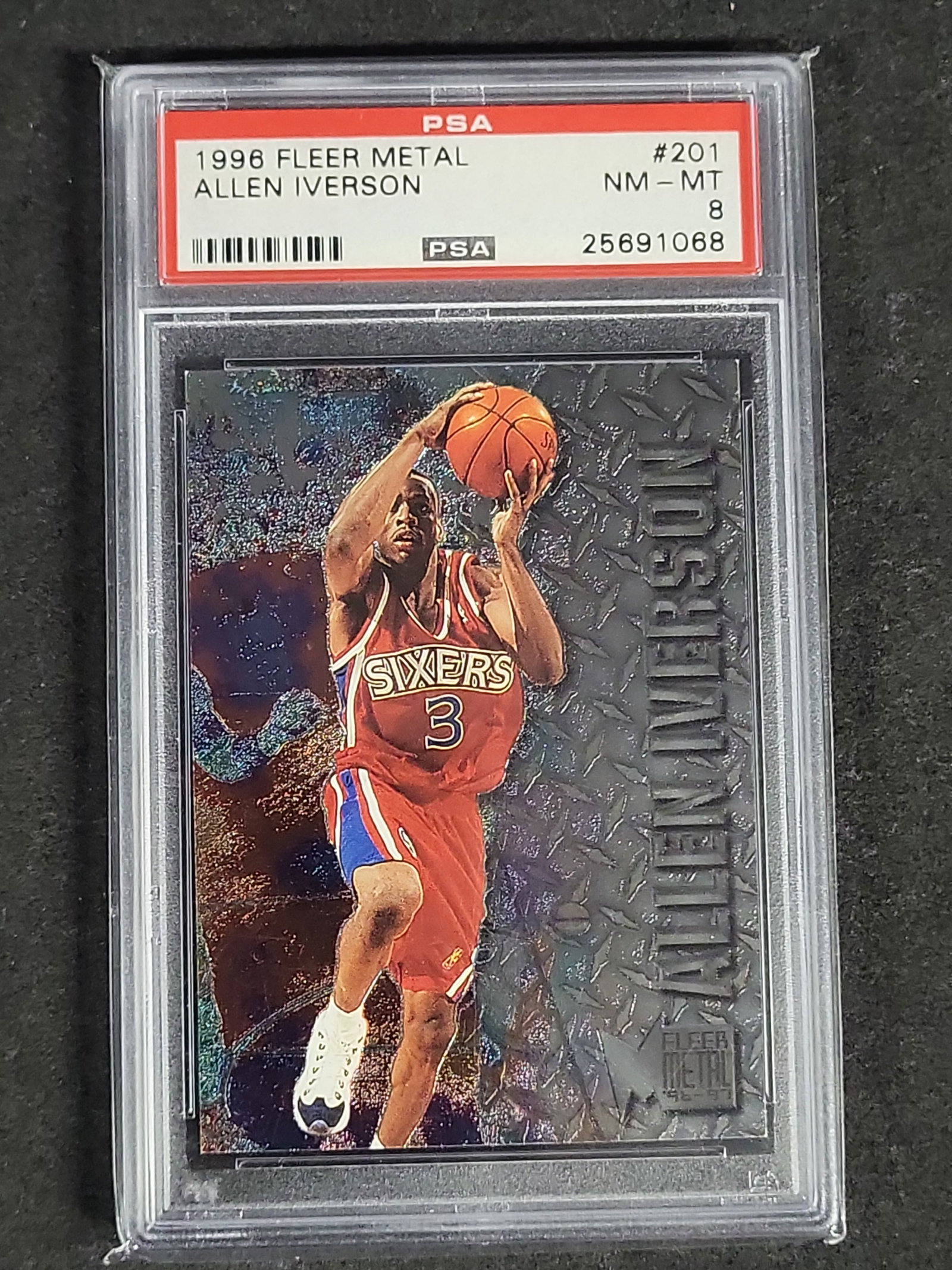I04641 | 1996 Fleer Metal Allen Iverson PSA 8: IMPORTANT â€“ PLEASE REVIEW BEFORE BIDDING: Aeron House makes every effort to accurately identify and describe each lot; however, titles and descriptions may contain errors, omissions, or AI-a